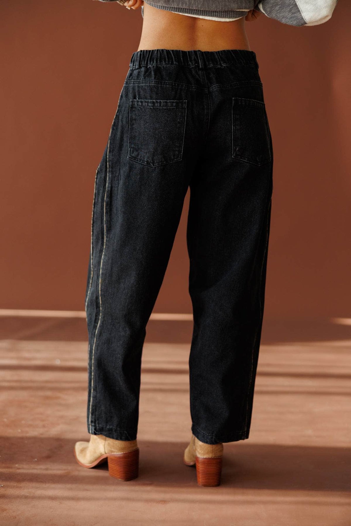 Black Leopard Piping Detail Barrel Jean in black, back view showing the barrel leg seams