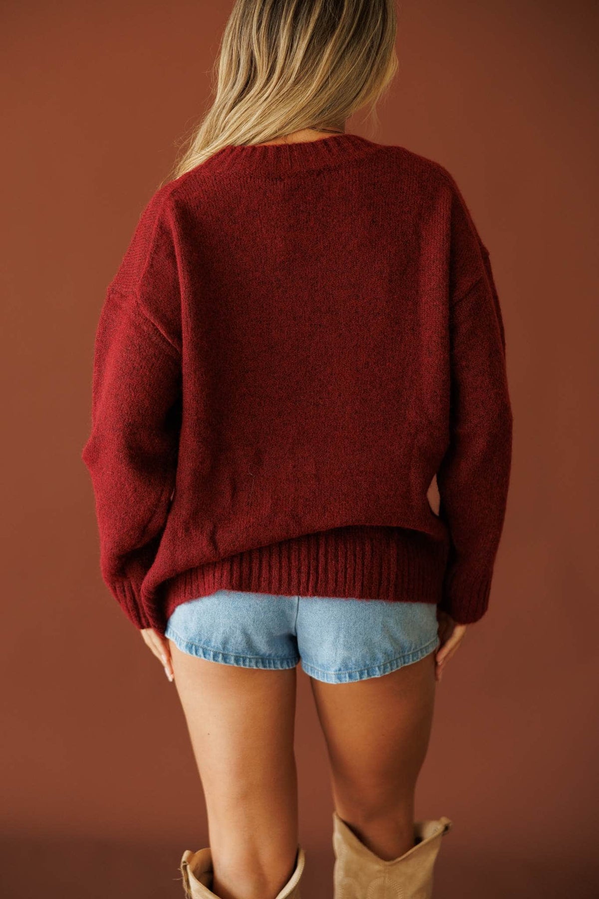 Be Your Cowgirl Sweater in burgundy, back view showing the oversized knit sweater