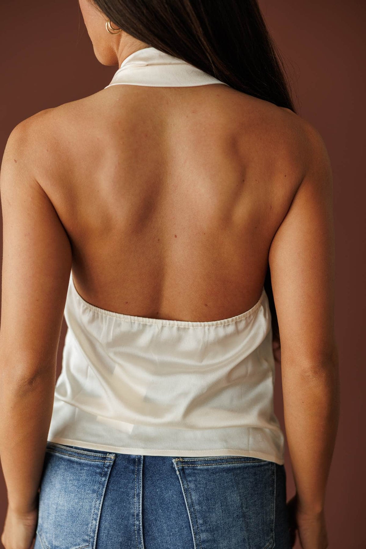 Ivory satin halter top with a draped neckline