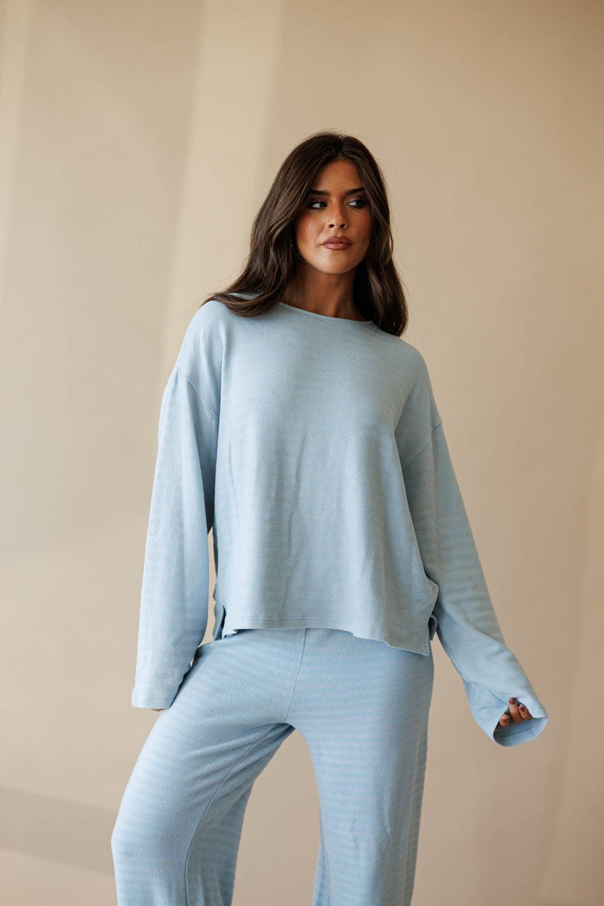 Pale blue ribbed knit long sleeve top, front view