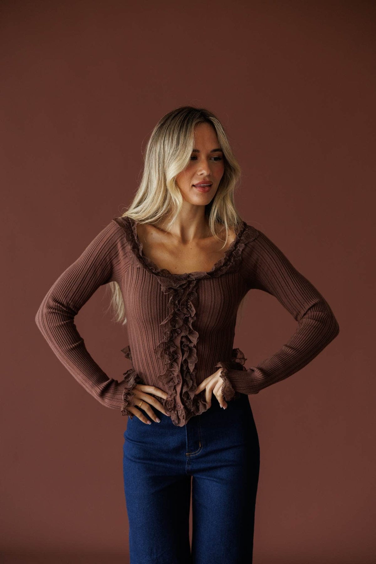 Colette Ruffle Top in mocha, front view on model with dark wash jeans