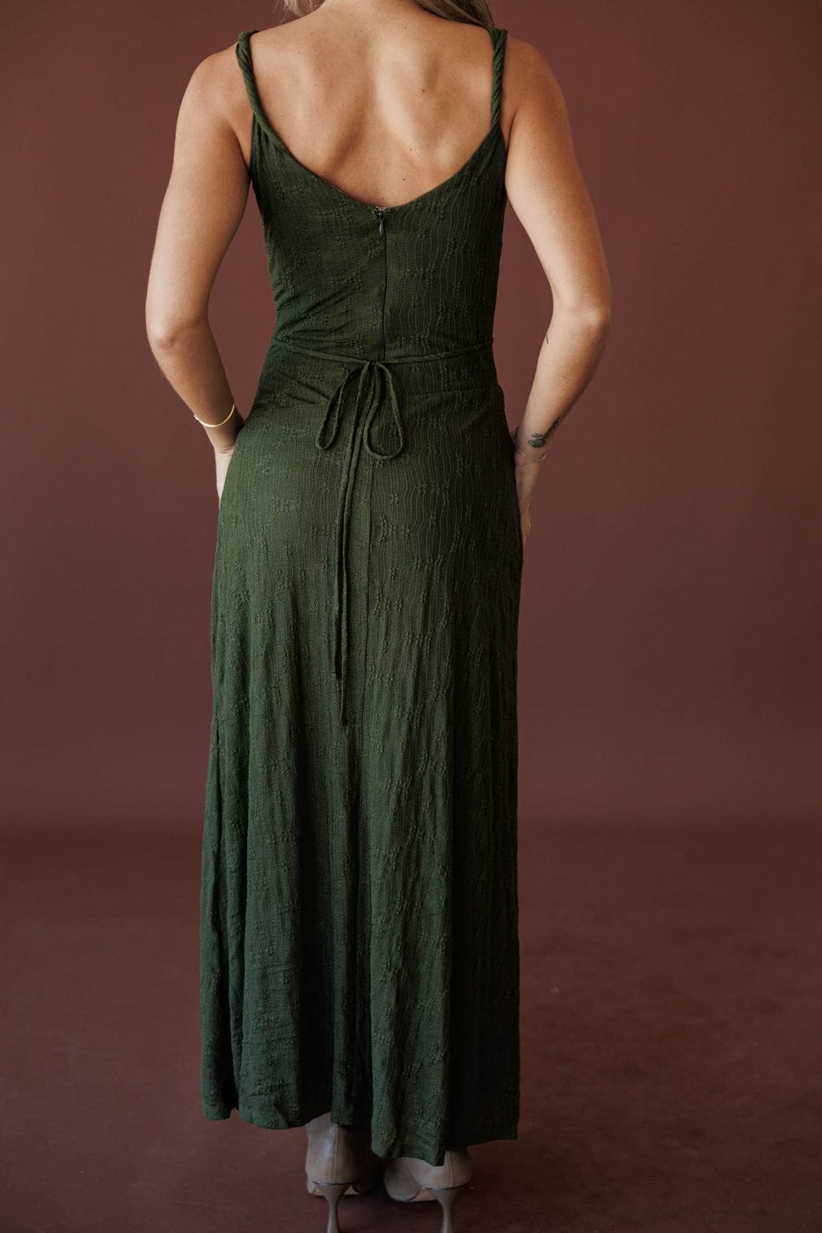 Evergreen Evening Maxi Dress, side view of the pleated skirt