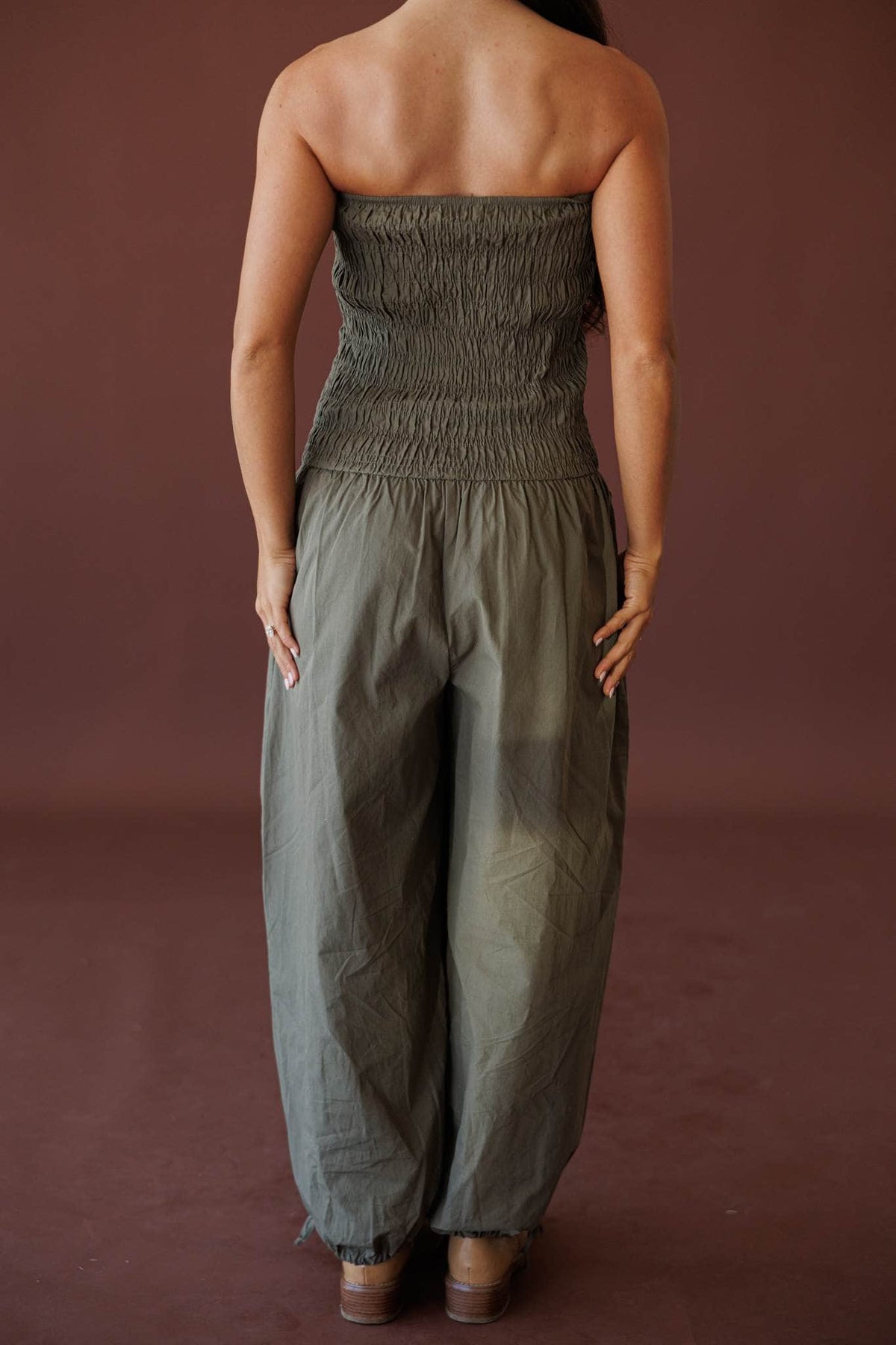 Evening Event Wide Leg Jumpsuit, in olive, back view of the smocked bodice