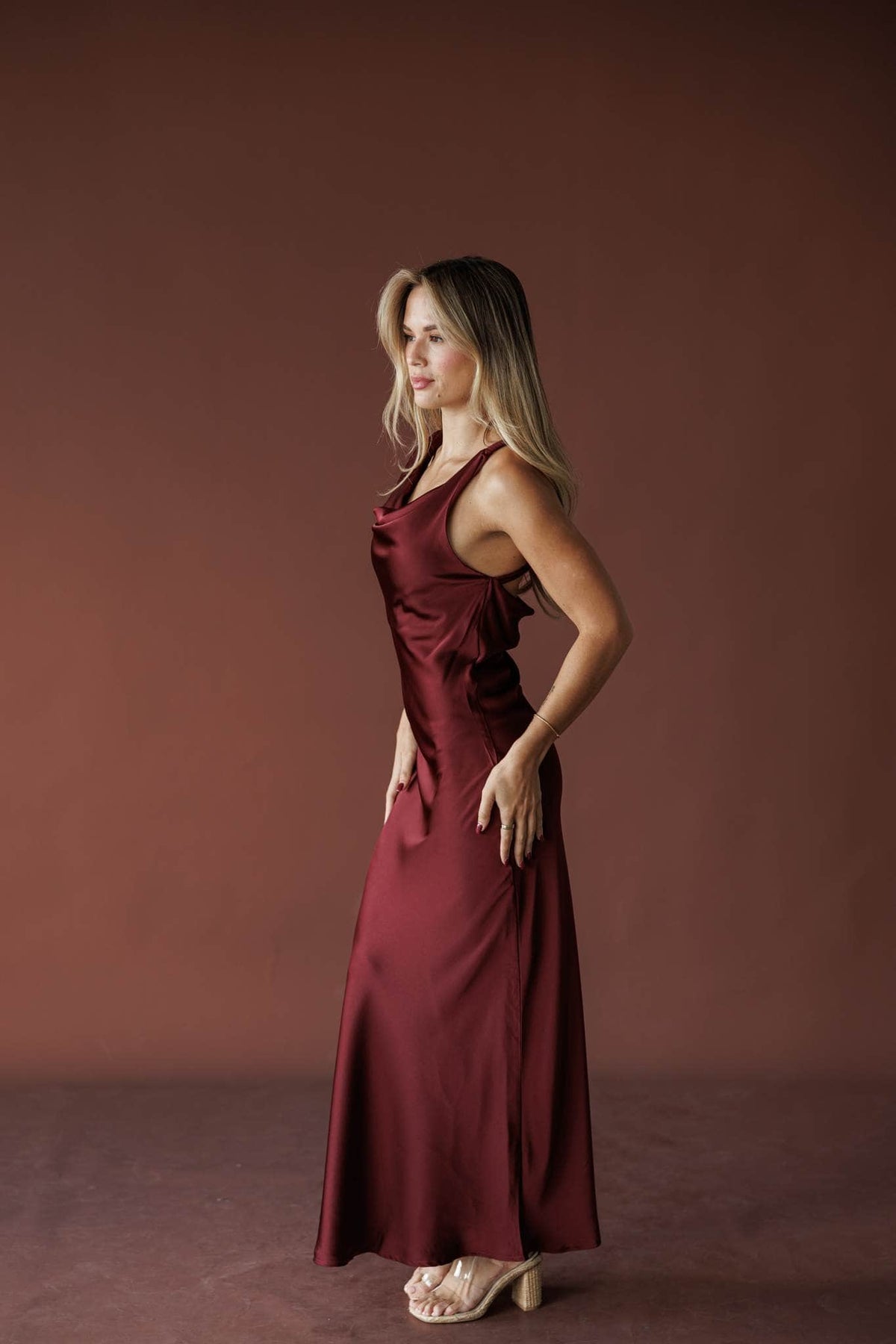 Cabernet Cowl Maxi Dress, in burgundy, side view of the bias skirt