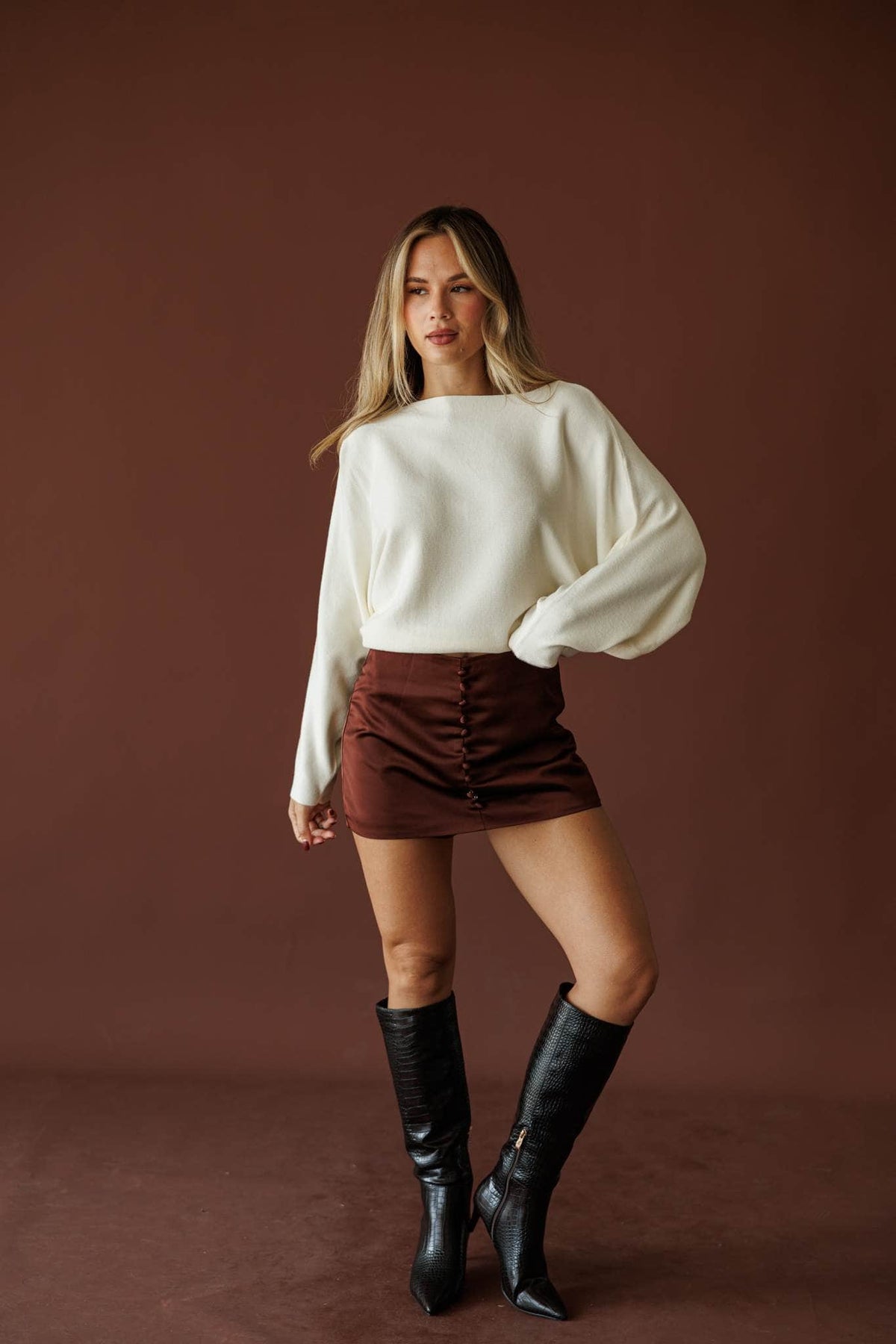 Button Up Satin Skort, in crimson brown, full-length front view with a cream sweater