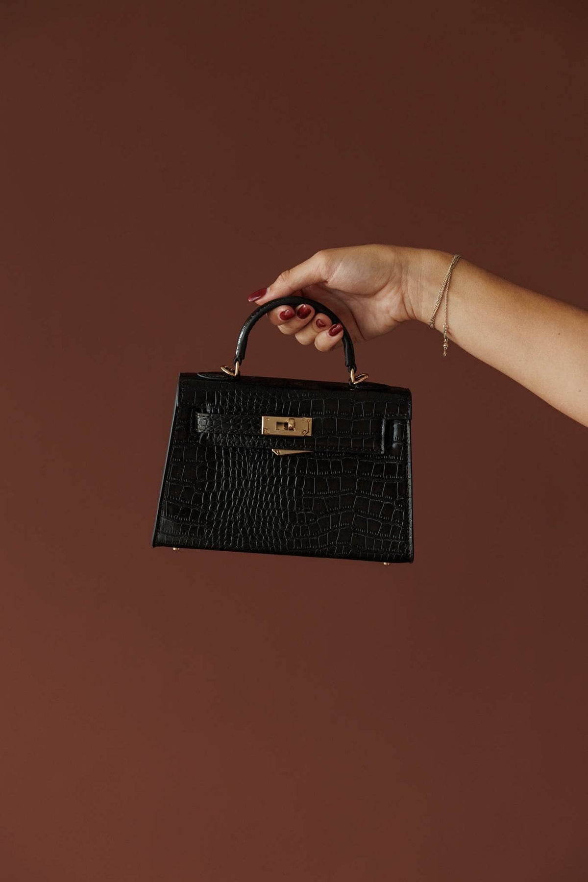 Hariette Handle Bag***, in dark cacao, front view of the croc top handle bag