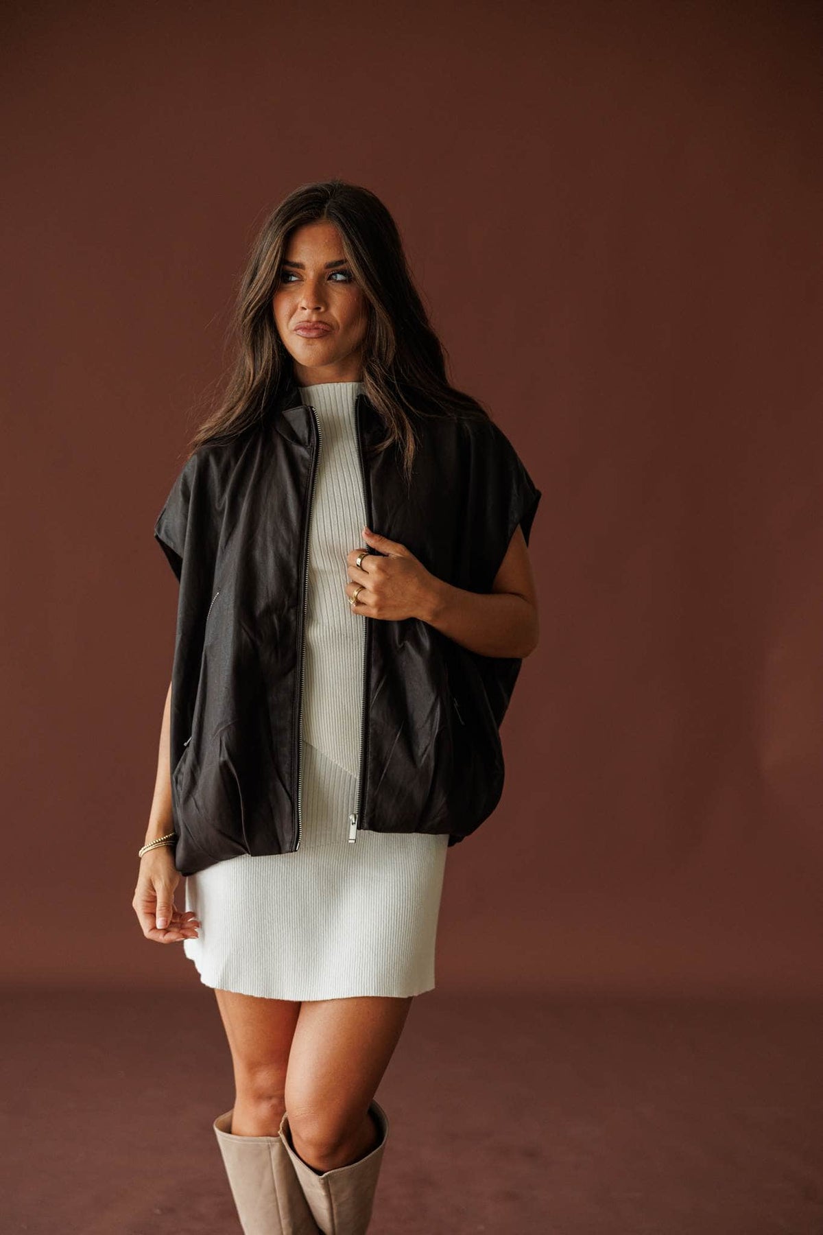 Stockyard Leather Vest in brown, full-length view worn over a cream mini dress with tall boots