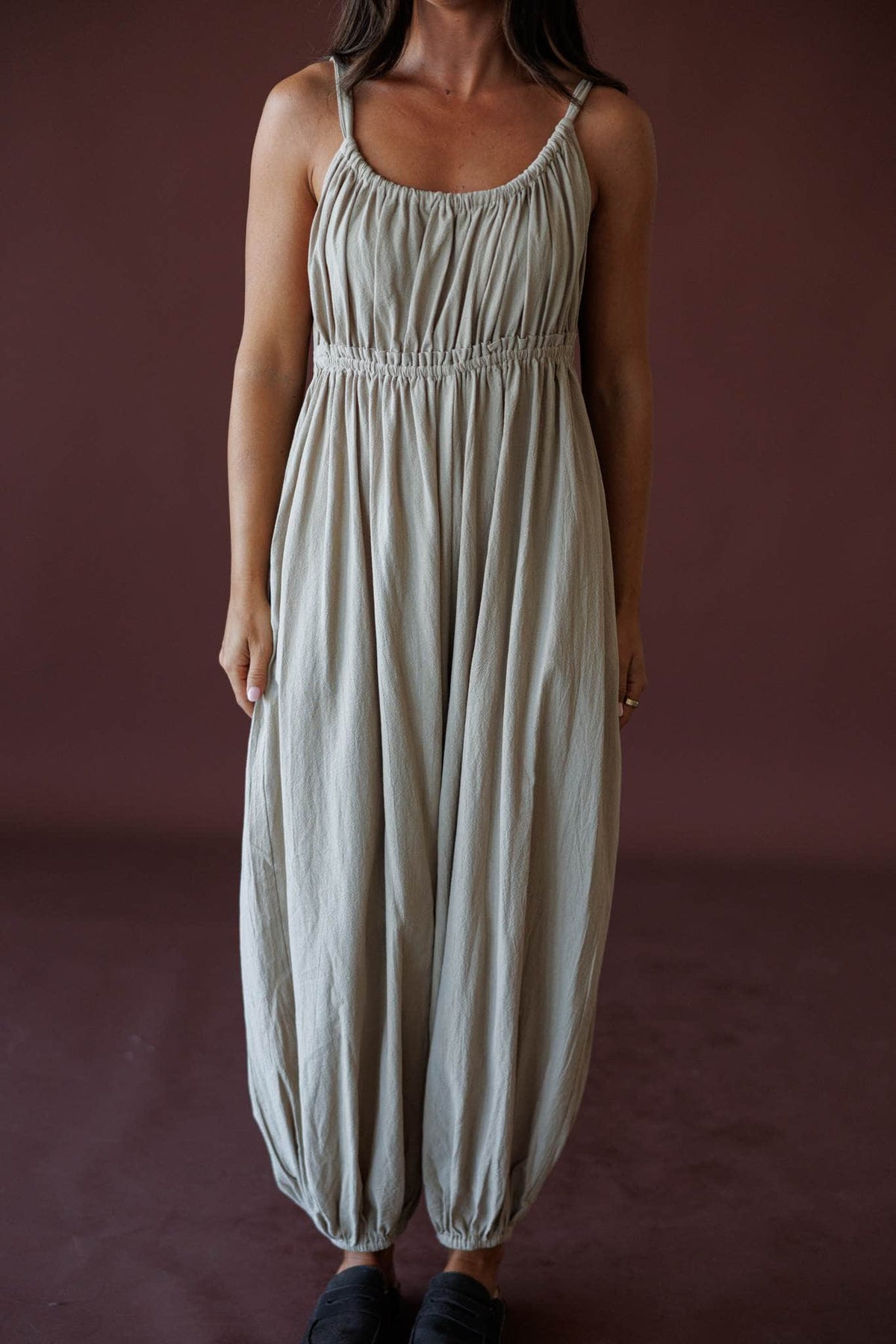 The Roam Jumpsuit, in sand, front view of the gathered bodice