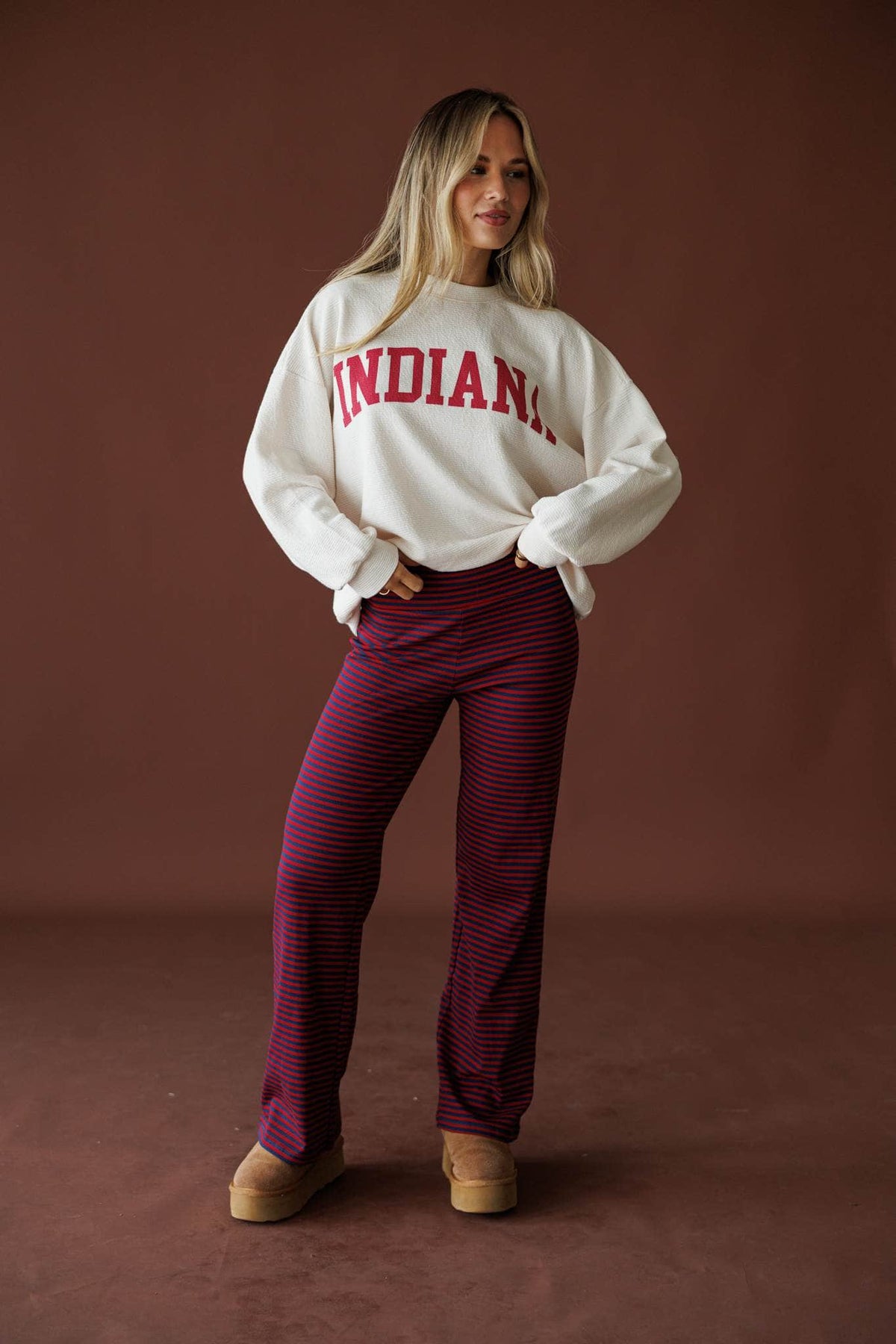 Indiana Cloud Knit Sweatshirt in ivory, front view on model with hands behind the back