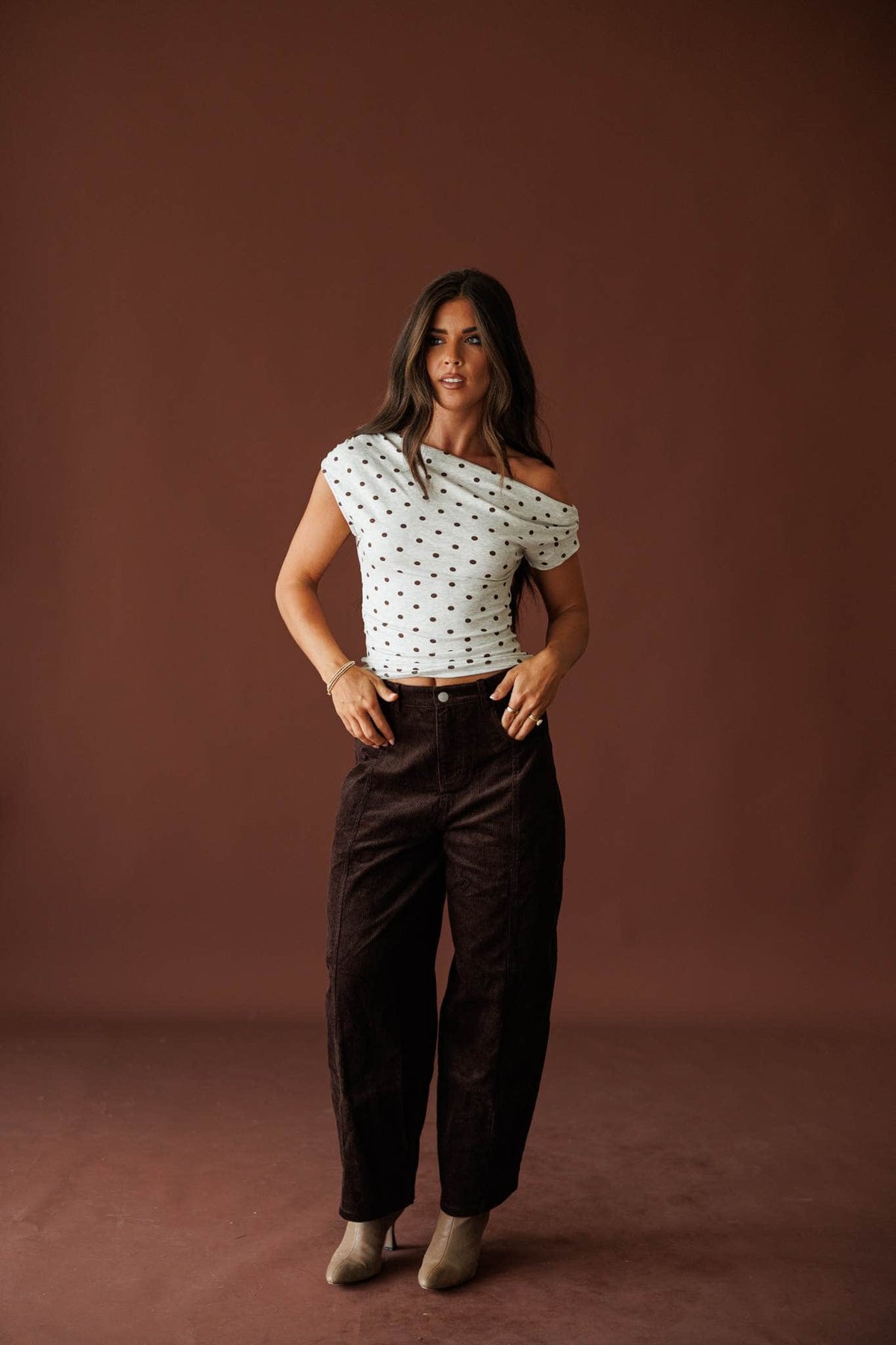 Bookshop Corduroy Barrel Pants in dark chocolate, full-length view styled with a dotted top