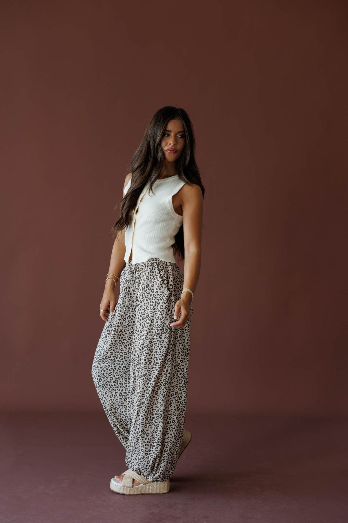 Leopard Balloon Pants in leopard, full-length view on model turned to the side