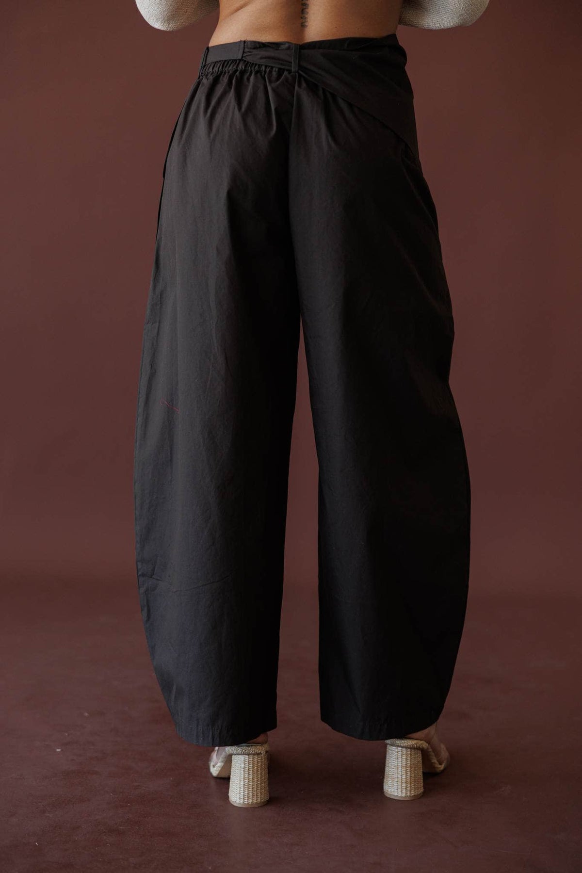 Scarf Tie Trouser, in dark chocolate, back view of the barrel leg