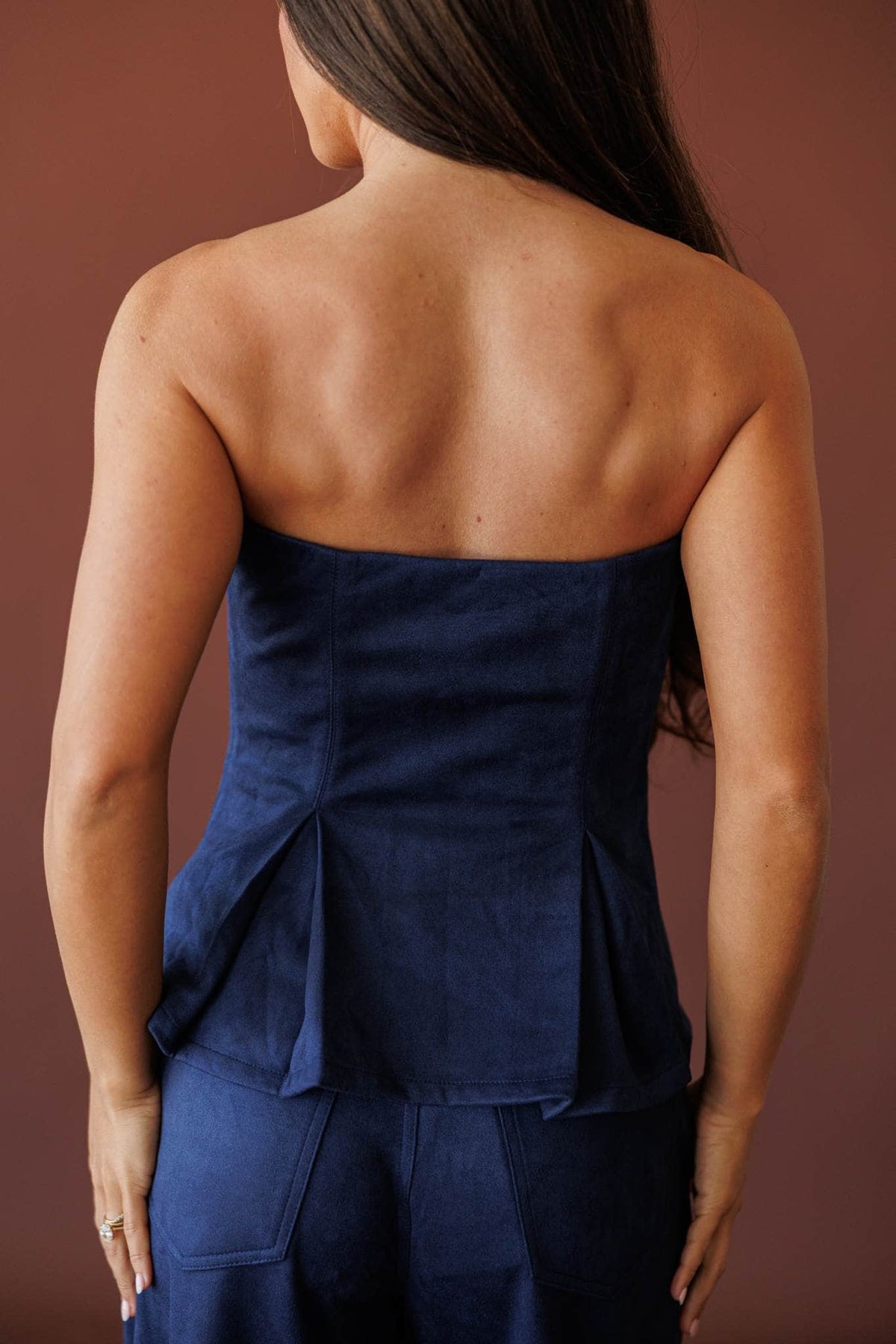 Suede Society Strapless Top, in navy, back view of the strapless top
