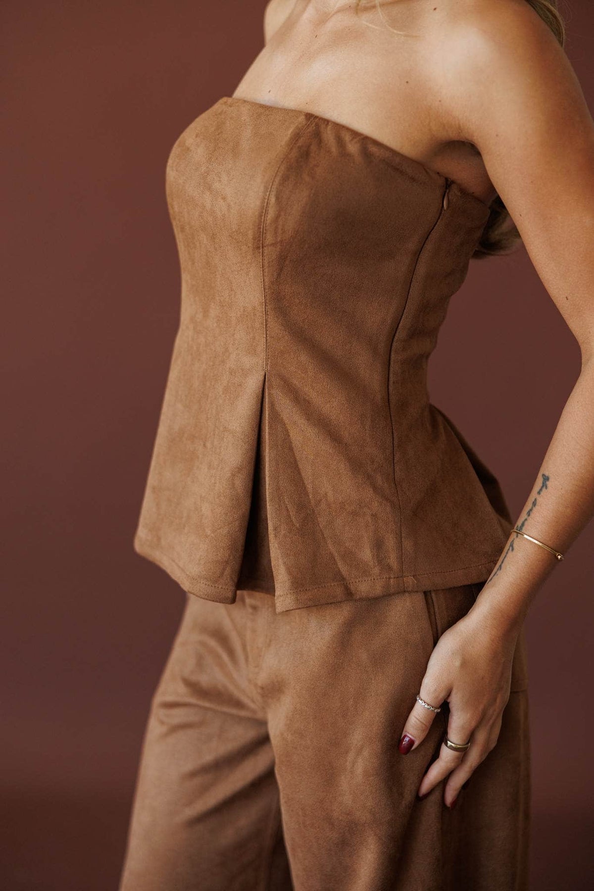 Suede Society Strapless Top, in camel, side view of the pleated flare