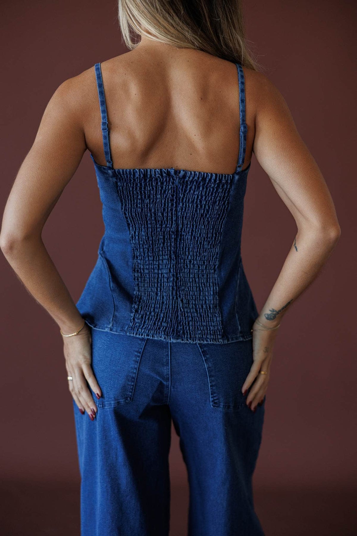 True Blue Denim Bustier, in dark denim, back view of the smocked panel
