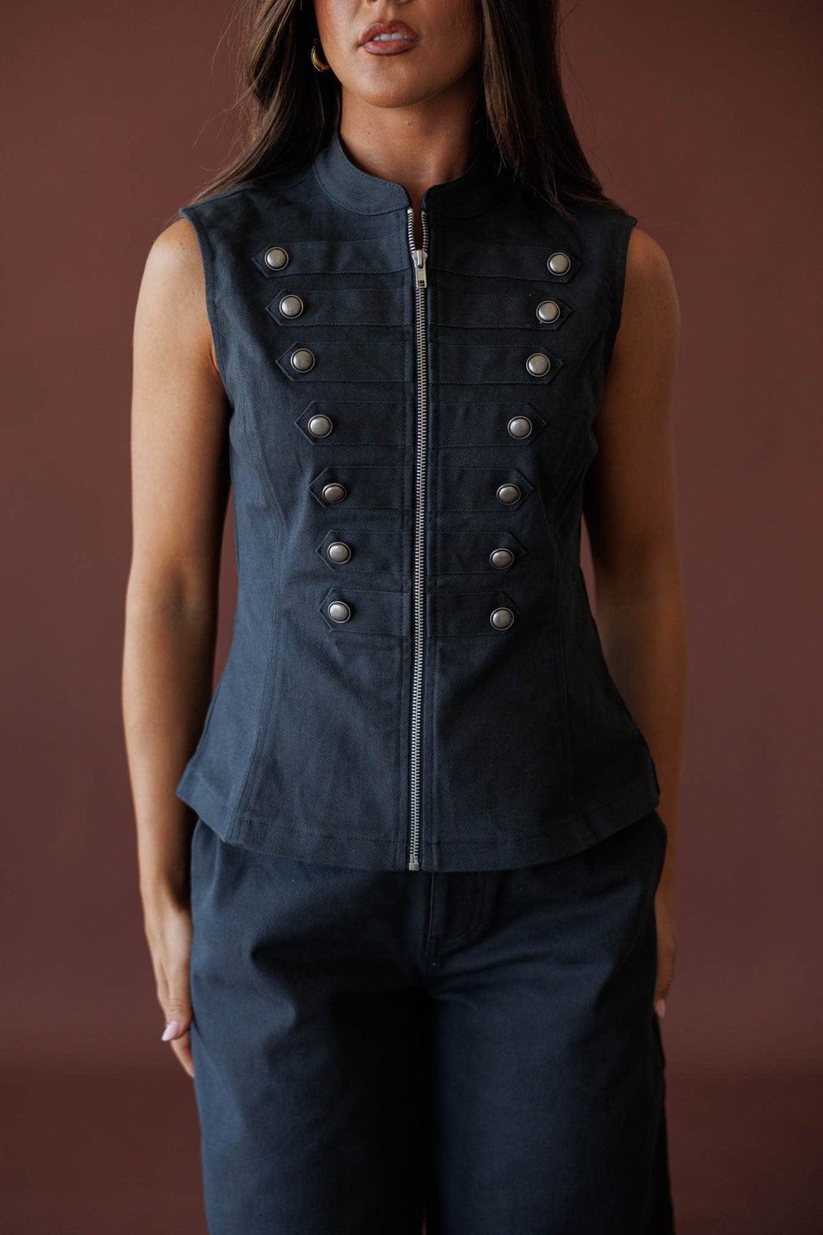 The Regent Vest, in navy, side view of the zip front