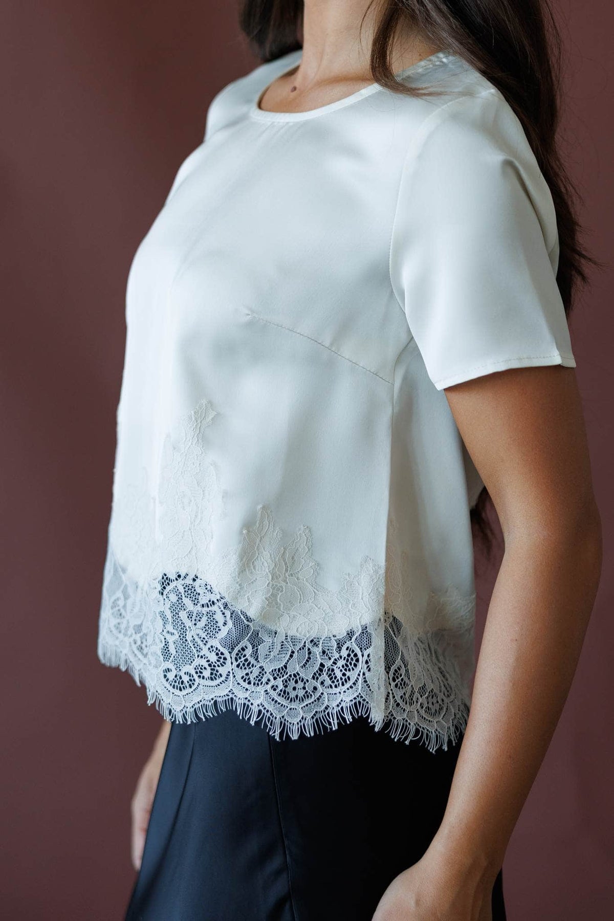 Cream short sleeve top with lace hem