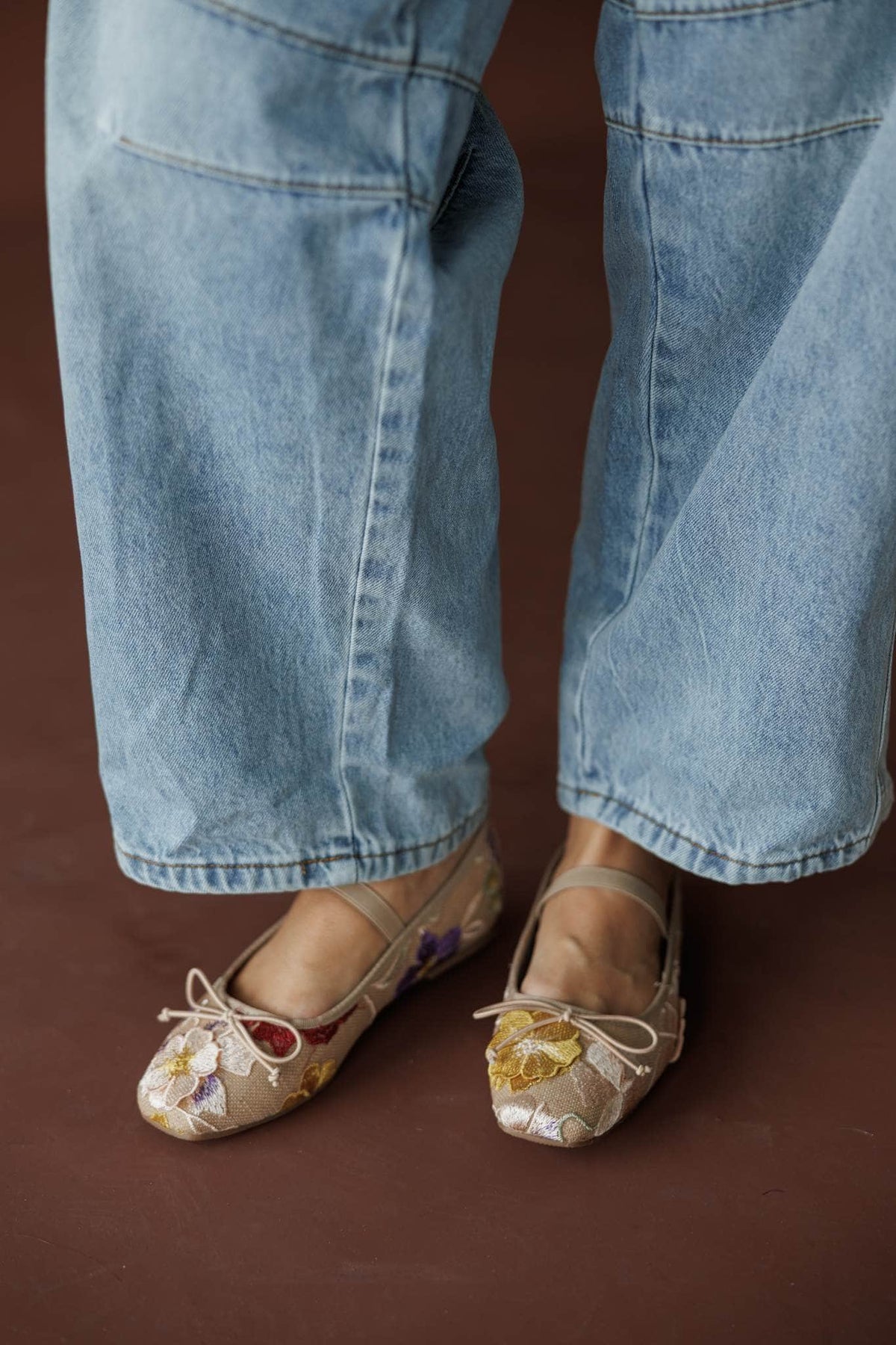 London Floral Ballet Flat, in floral, side view of the flats worn with denim