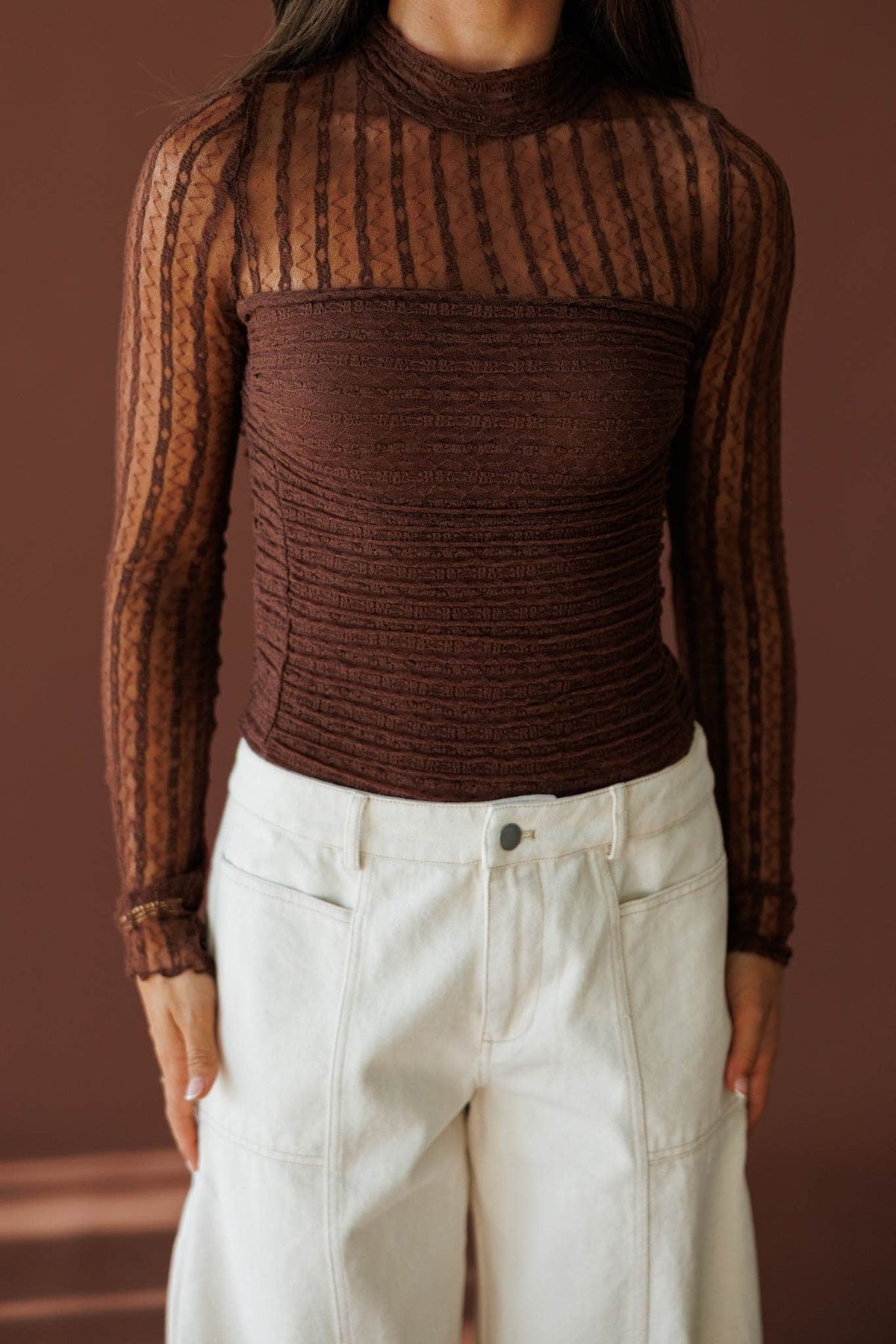 Lover In Lace Bodysuit in brown, front close-up of the sheer lace and mock neck