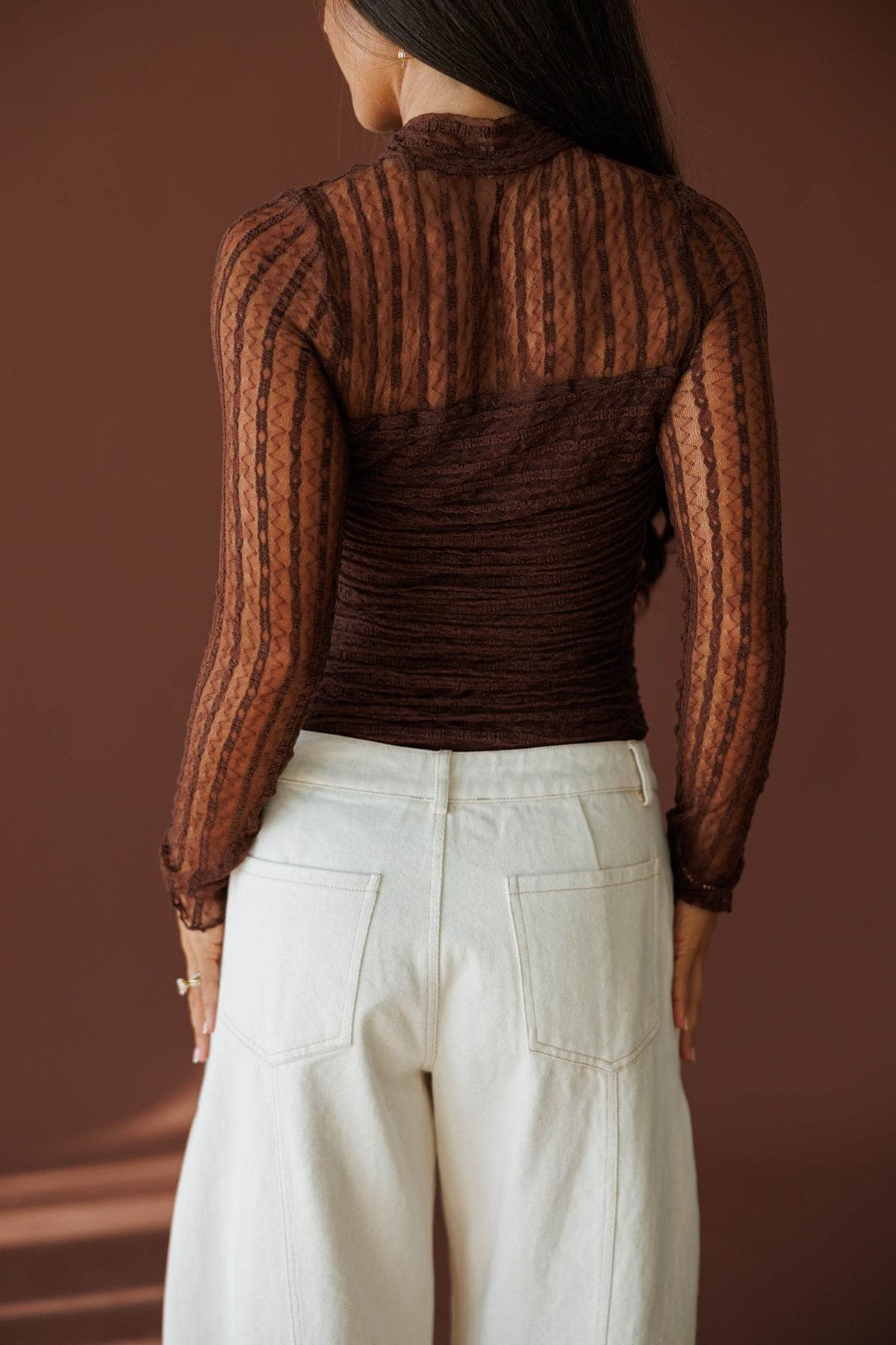 Lover In Lace Bodysuit in brown, back view showing the sheer lace back