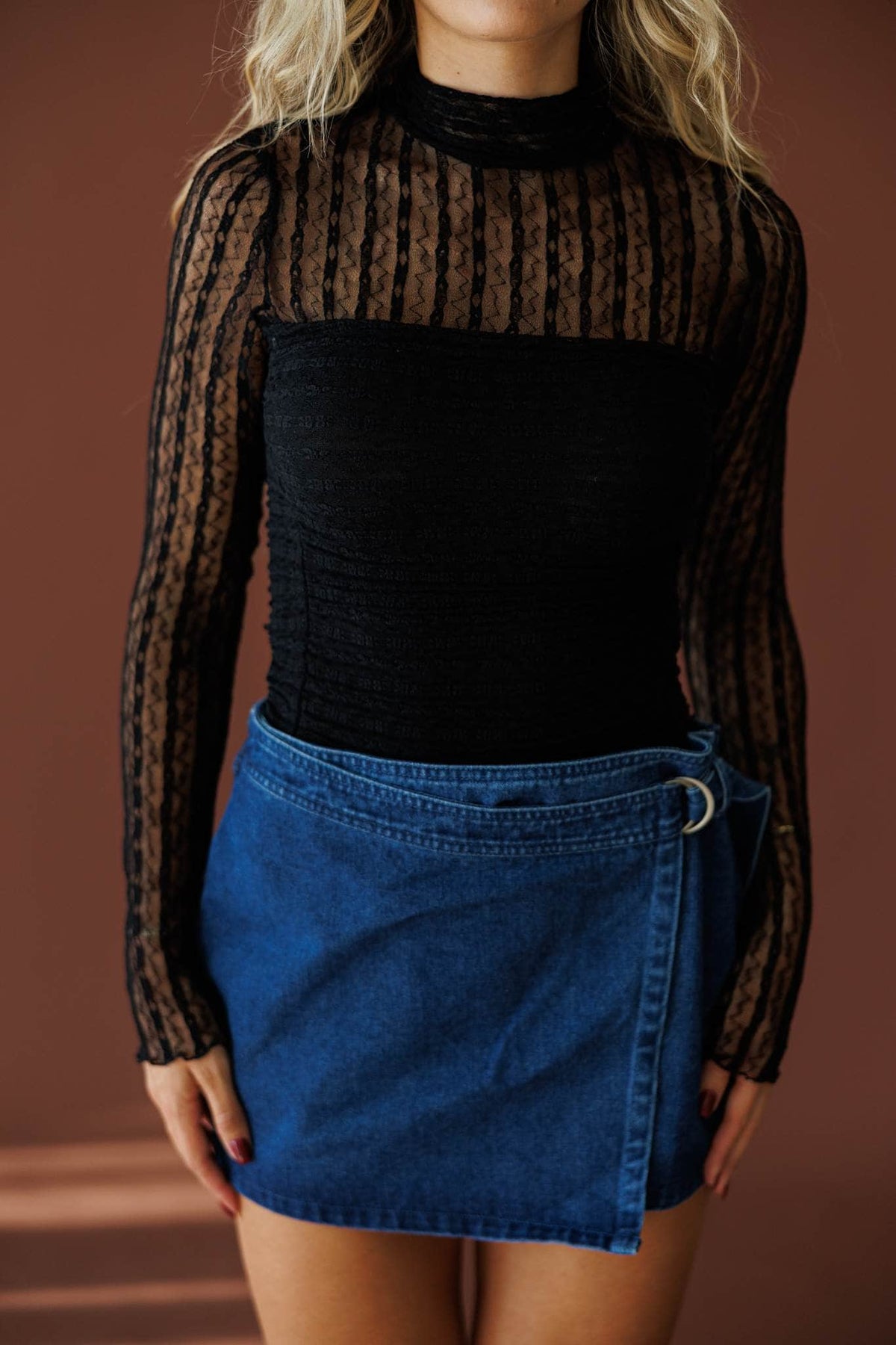 Lover In Lace Bodysuit in black, front close-up of the sheer lace and mock neck