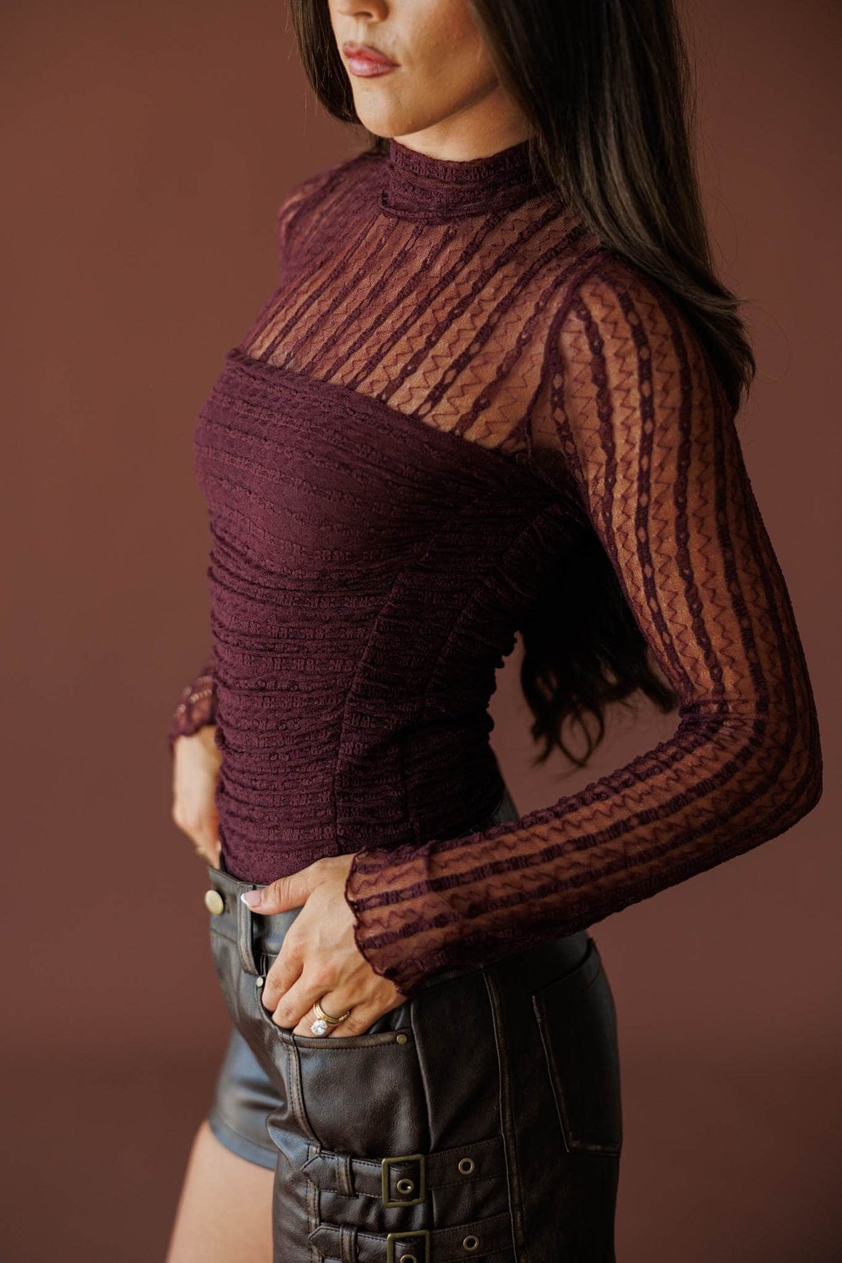 Lover In Lace Bodysuit in baked plum, side view showing the sheer lace sleeve