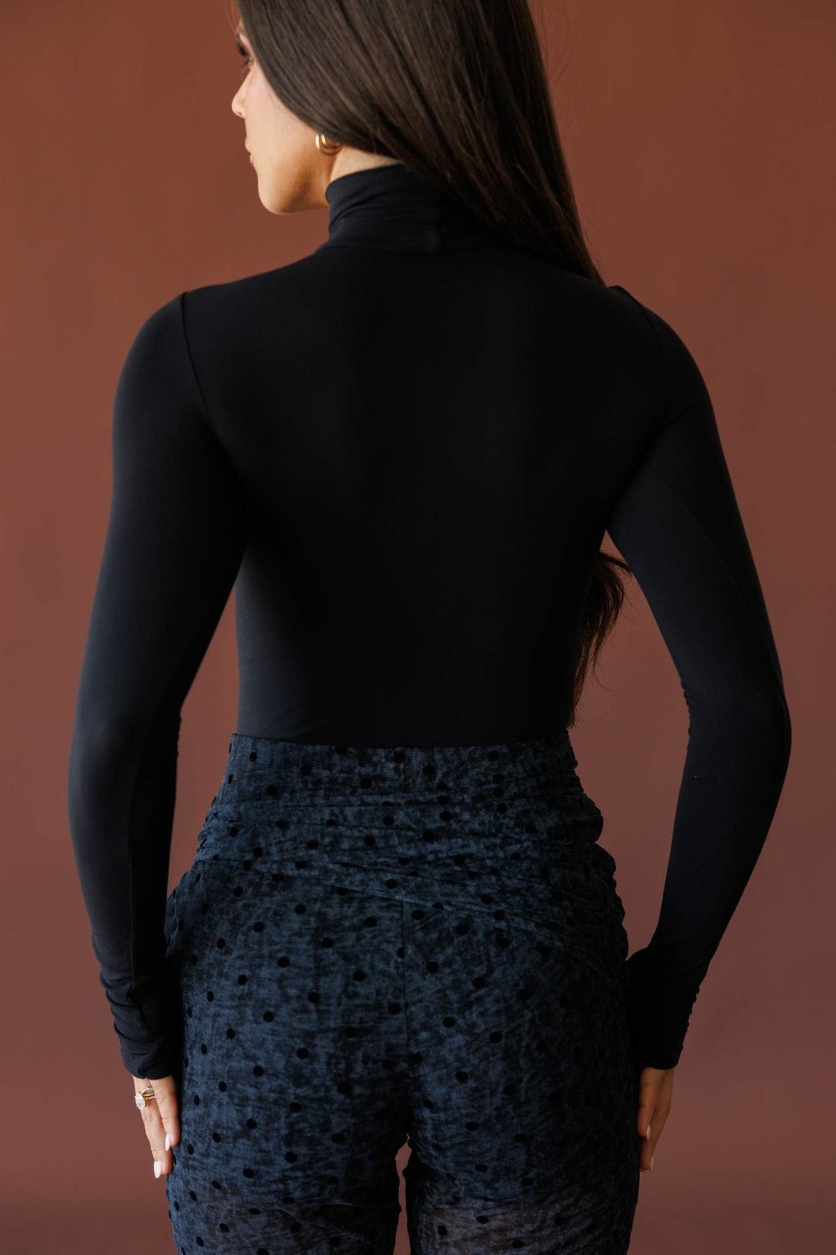 Black turtleneck bodysuit