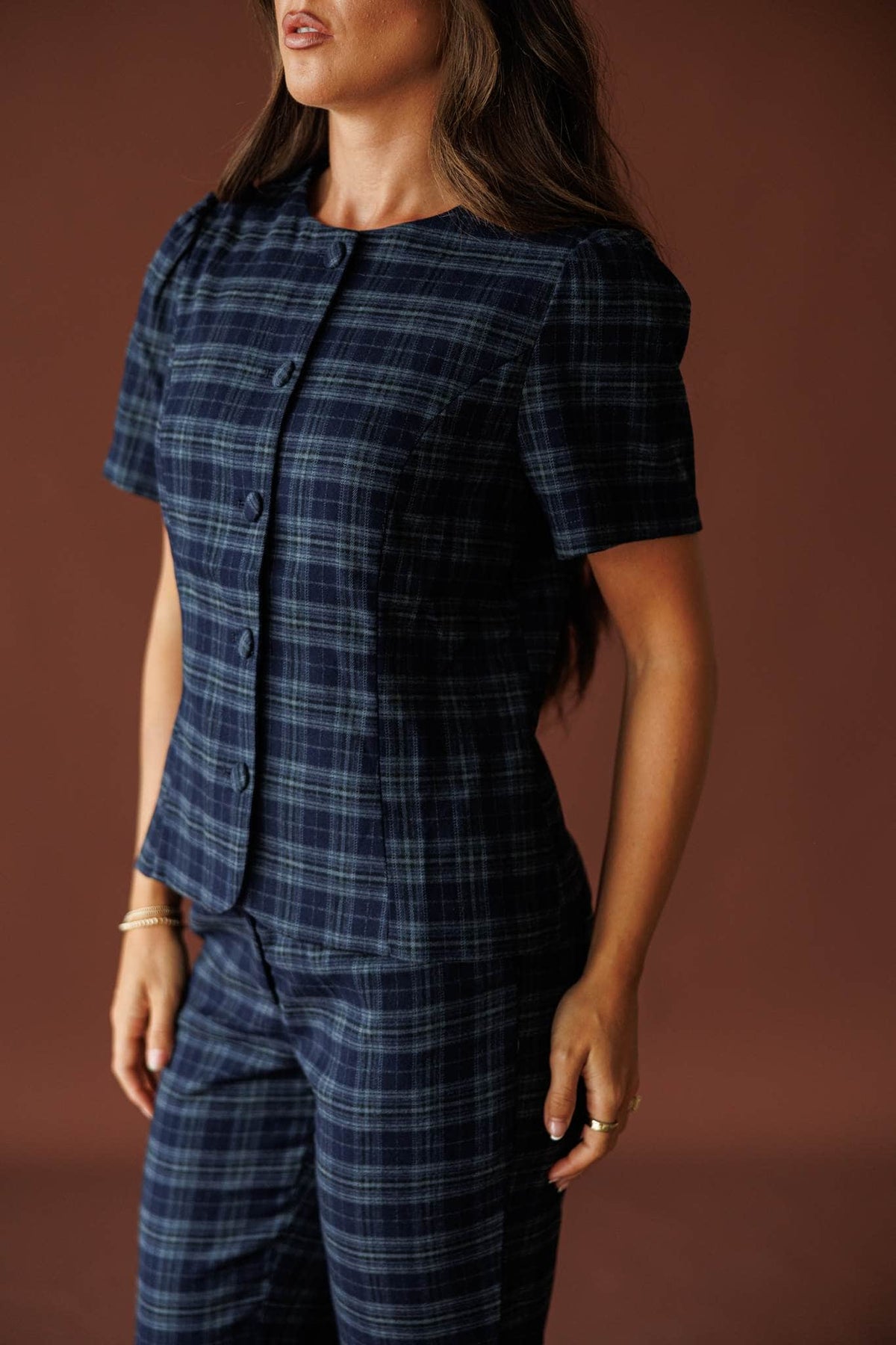 The Socialite Top in teal plaid, three-quarter view of the boxy structured fit