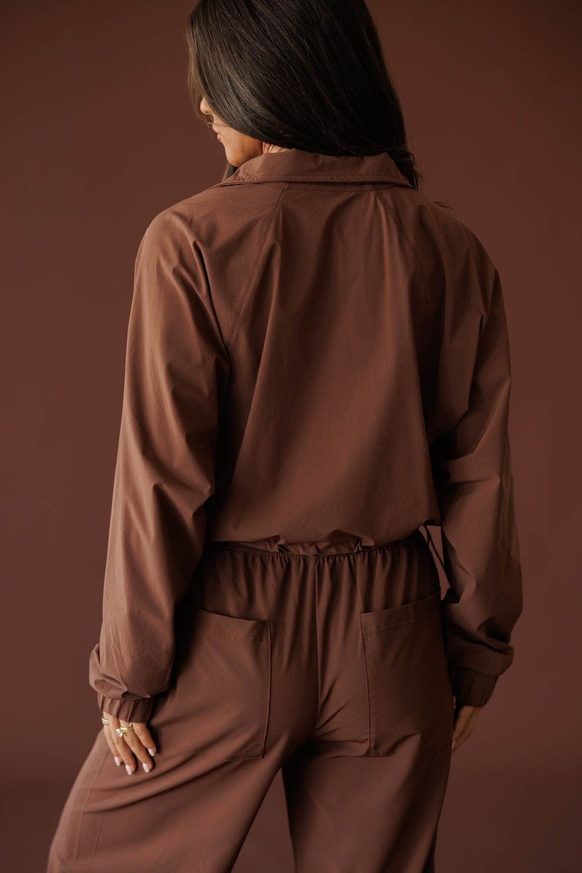 Pace Yourself Half Zip Pullover in cocoa, back view showing the cropped windbreaker