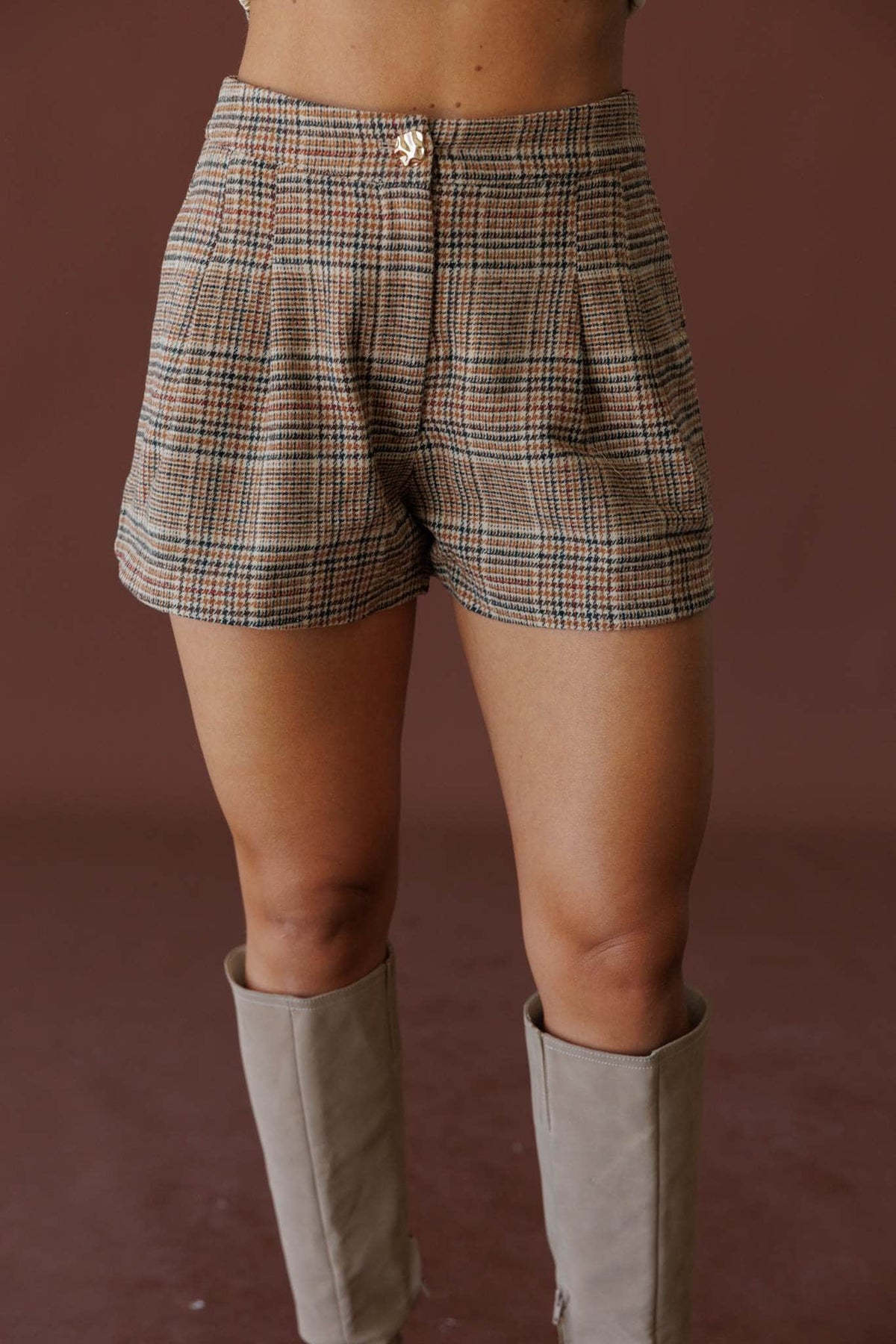 Tan plaid pleated shorts, front view