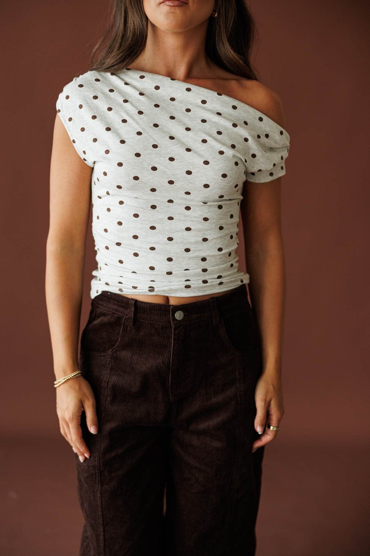 Dot After Dark Top in heather grey and brown dot, front view of the asymmetric off-shoulder neckline