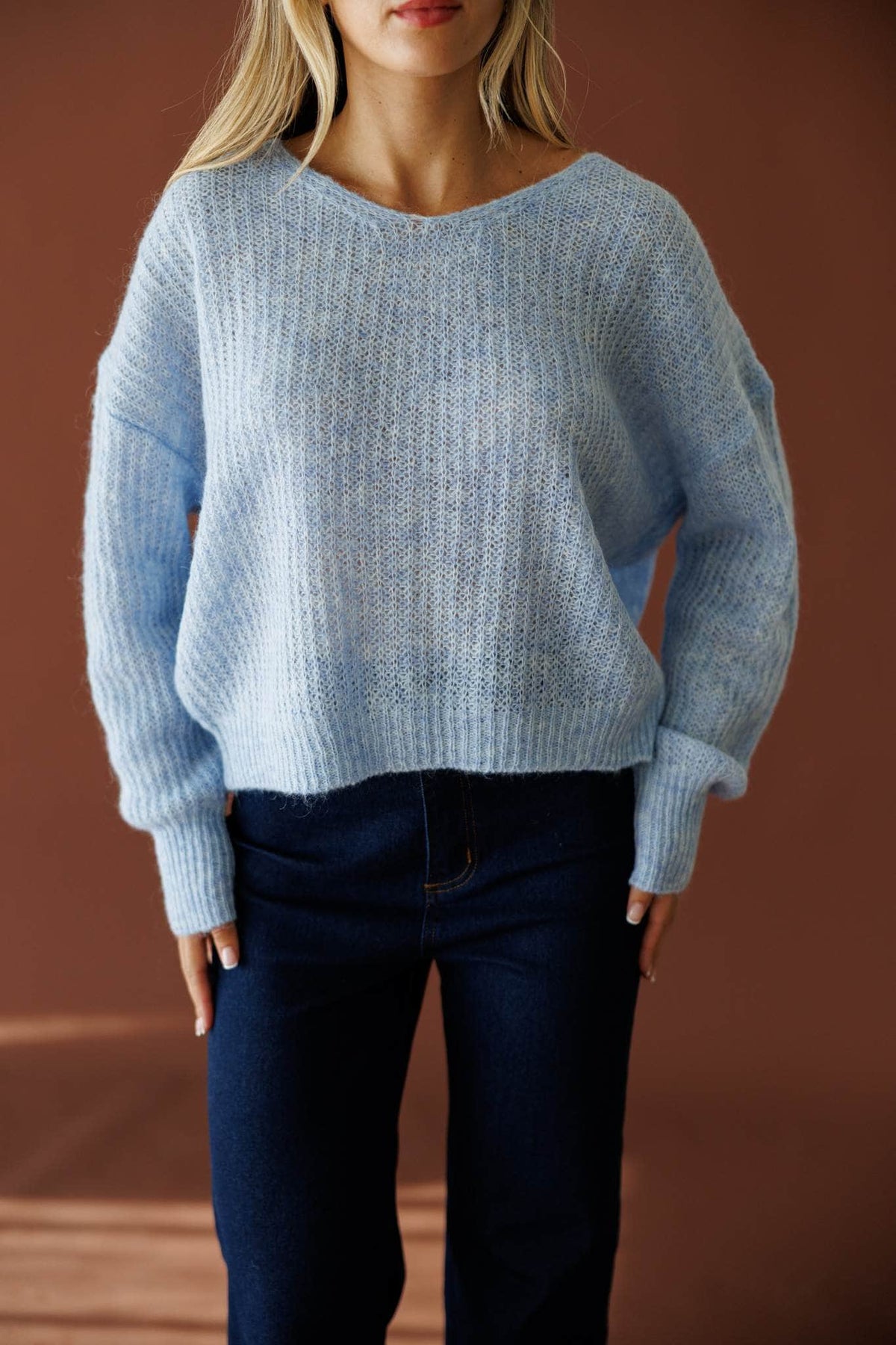 Repeat Staple Sweater in light blue, front close-up of the ribbed knit sweater