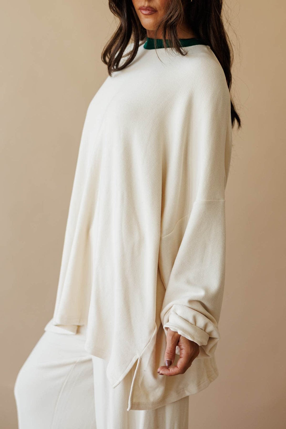 Cream oversized knit top with side slit