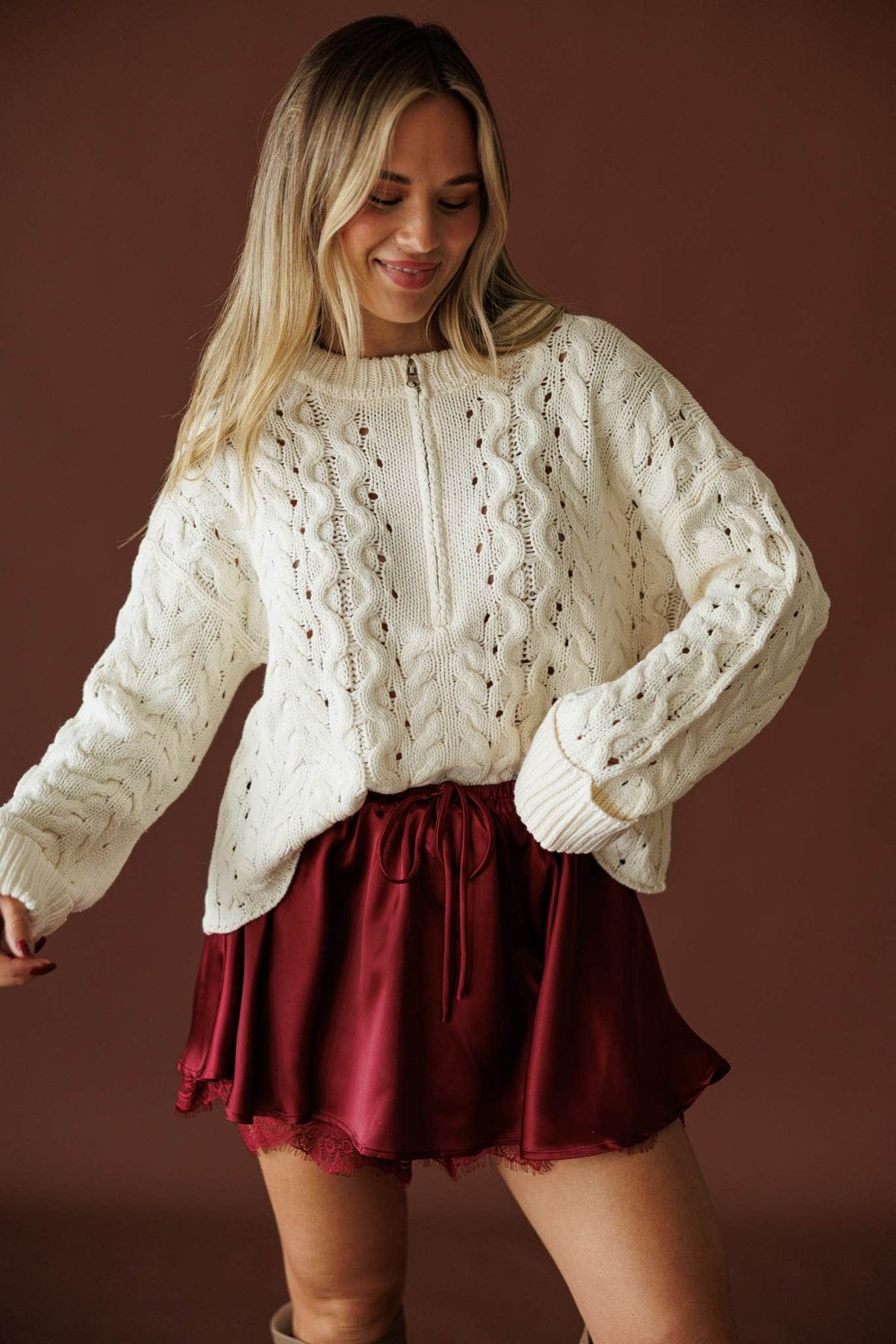 Cable Me Later Sweater in cream, front view with ribbed cuffs and hem