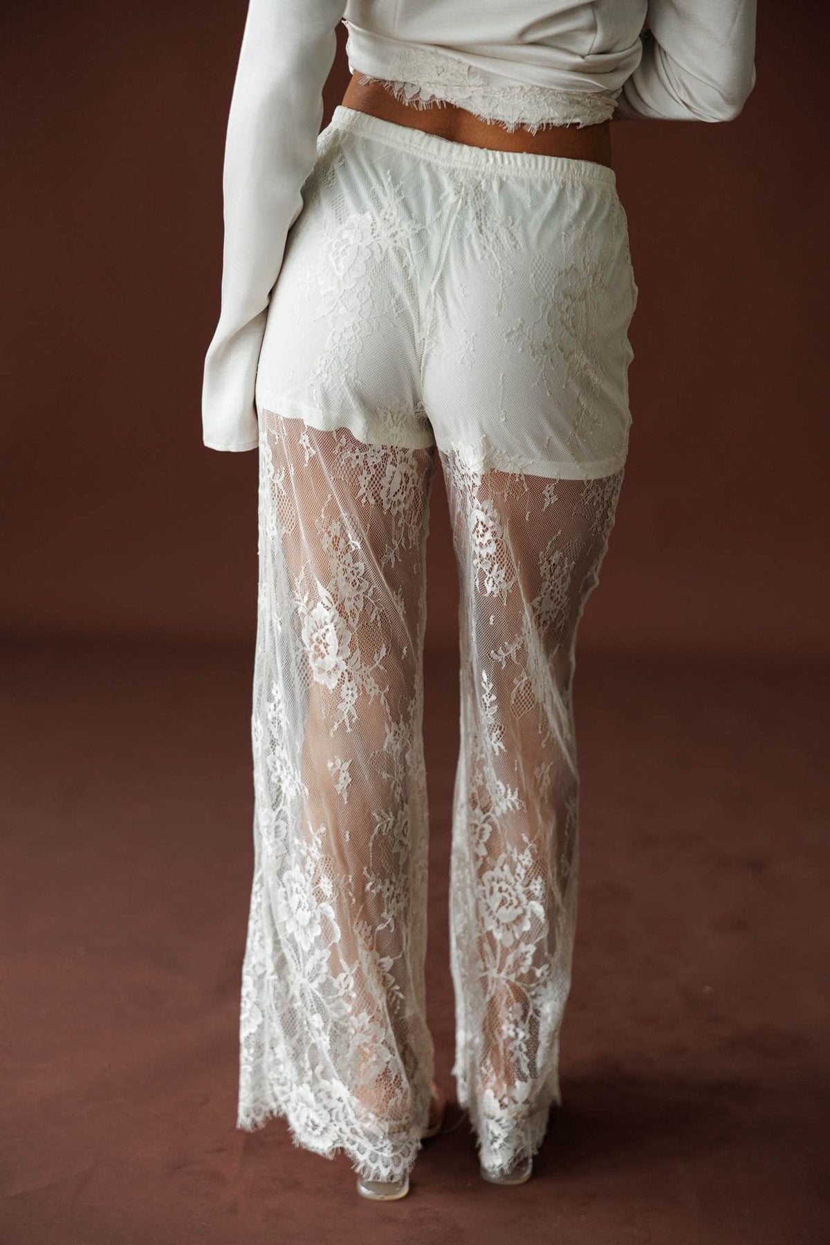 Lace Getaway Pants in champagne, side view showing the sheer lace wide leg