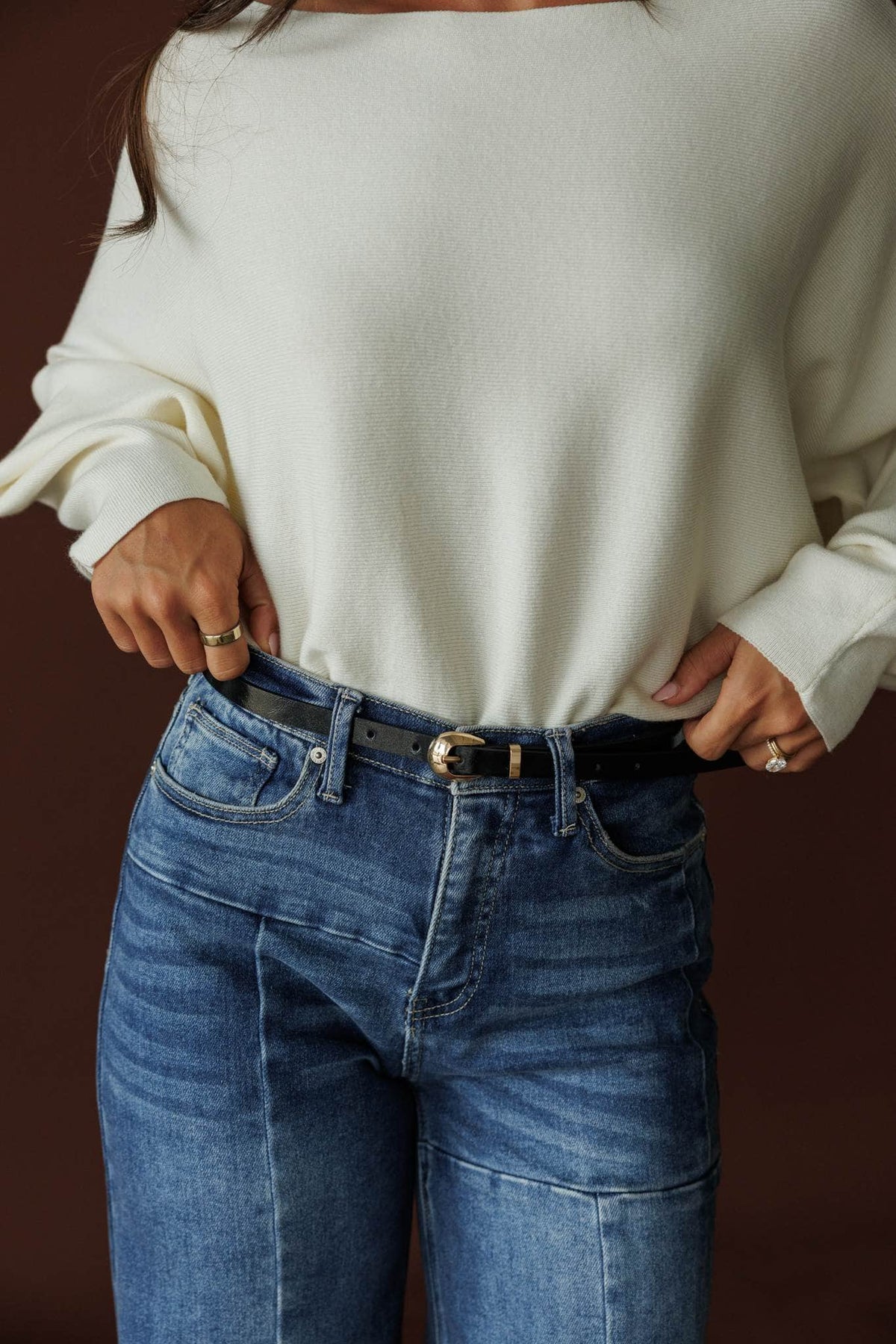 Paris Belt, in black shine, close front view of the petite gold buckle