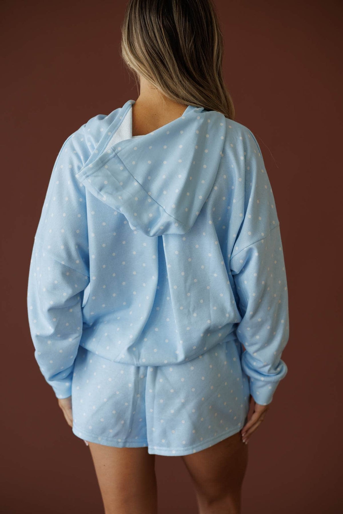 Baby Blue Polkadot Hoodie in baby blue, back view showing the hood and polka dot terry
