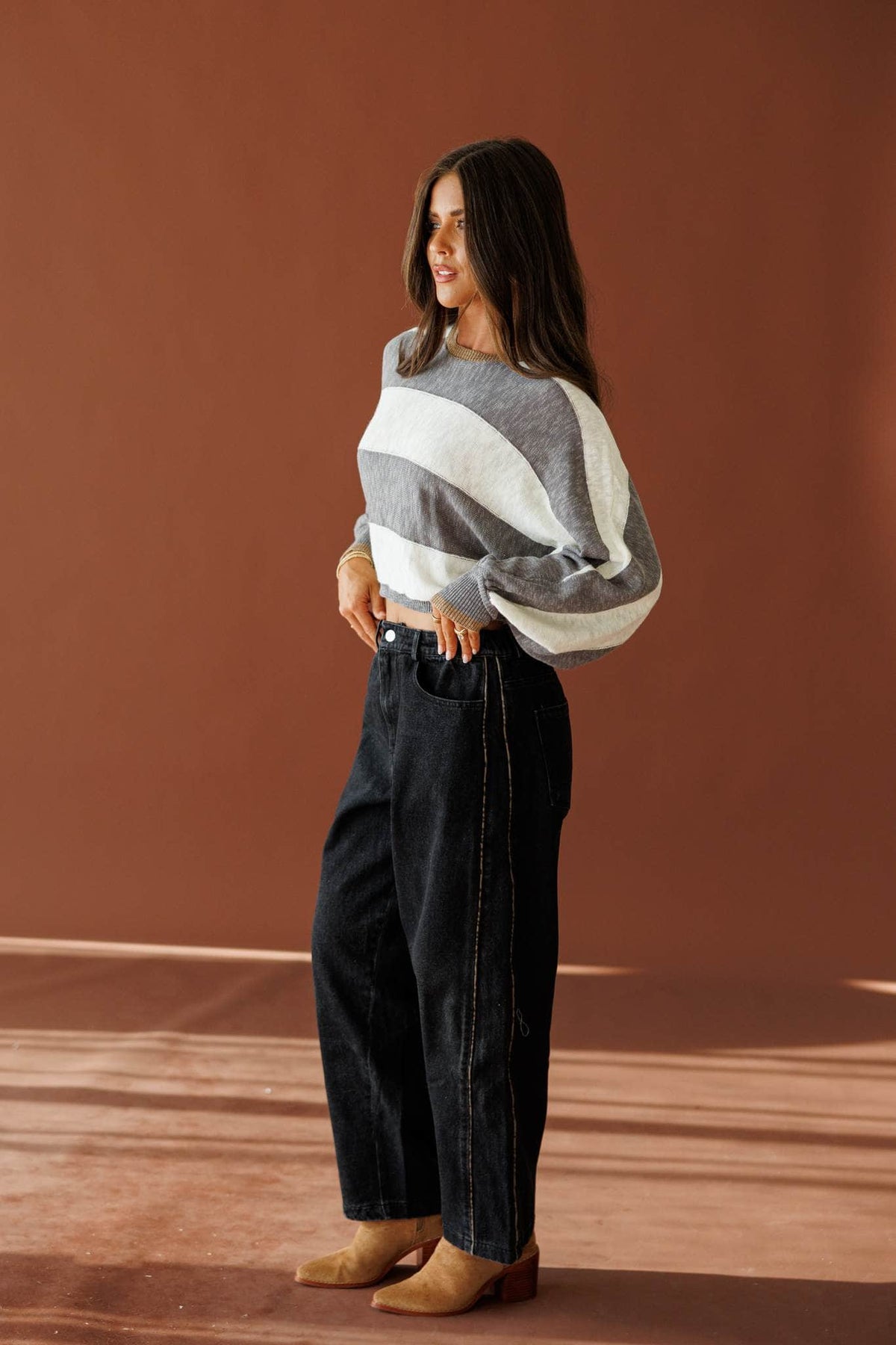 Black Leopard Piping Detail Barrel Jean in black, full-length view on model with tan boots