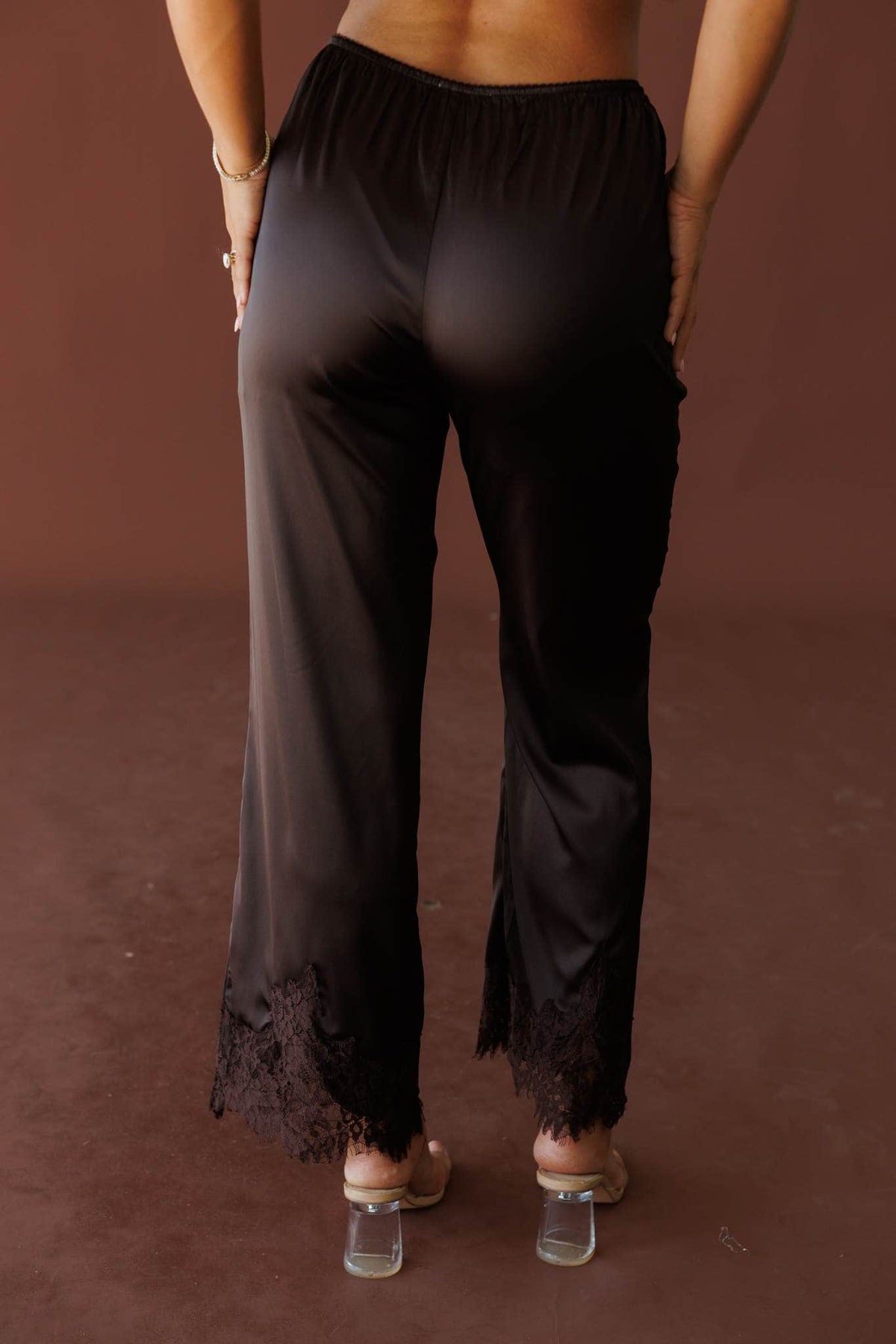 Dark brown satin pants with lace trim