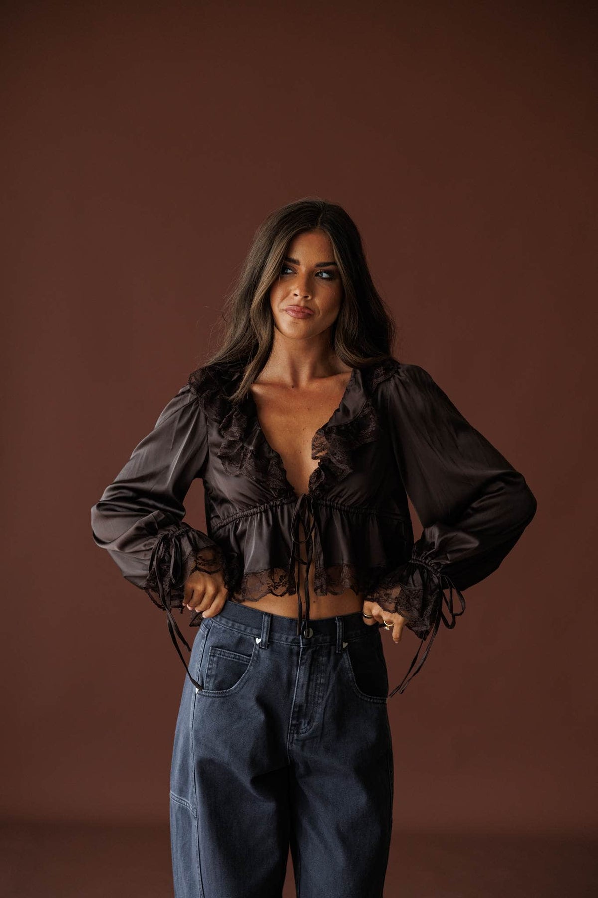 Ruffled Up Chiffon Blouse in brown, full-length view with wide leg jeans