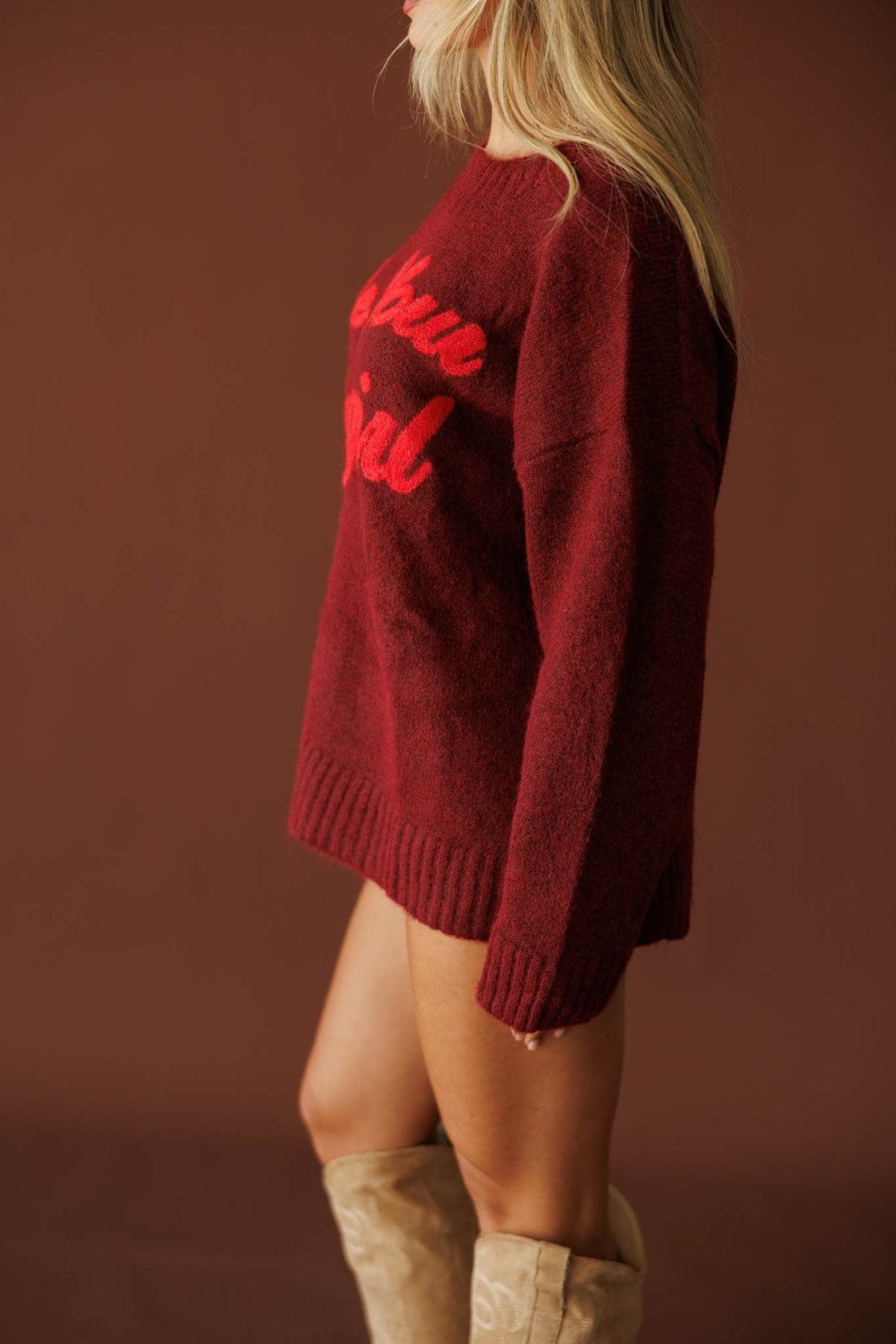 Be Your Cowgirl Sweater in burgundy, side view showing the drop shoulder and knit