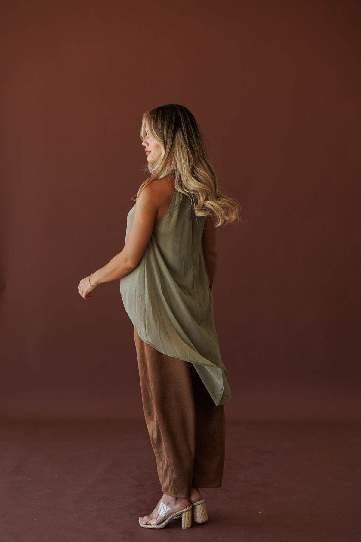 Olive Branch Halter Top, side view with the hem in motion