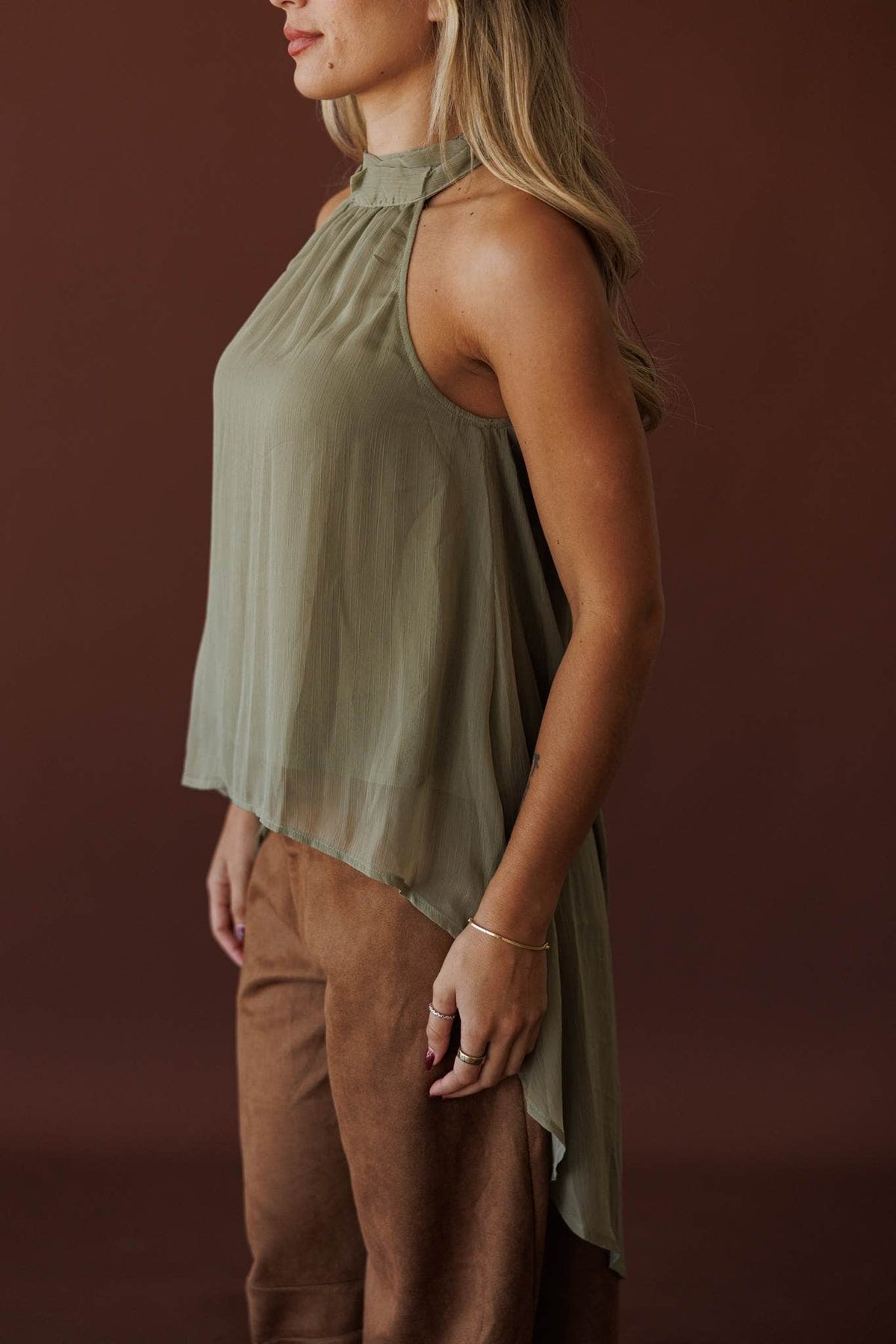 Olive Branch Halter Top, side view of the asymmetric hem