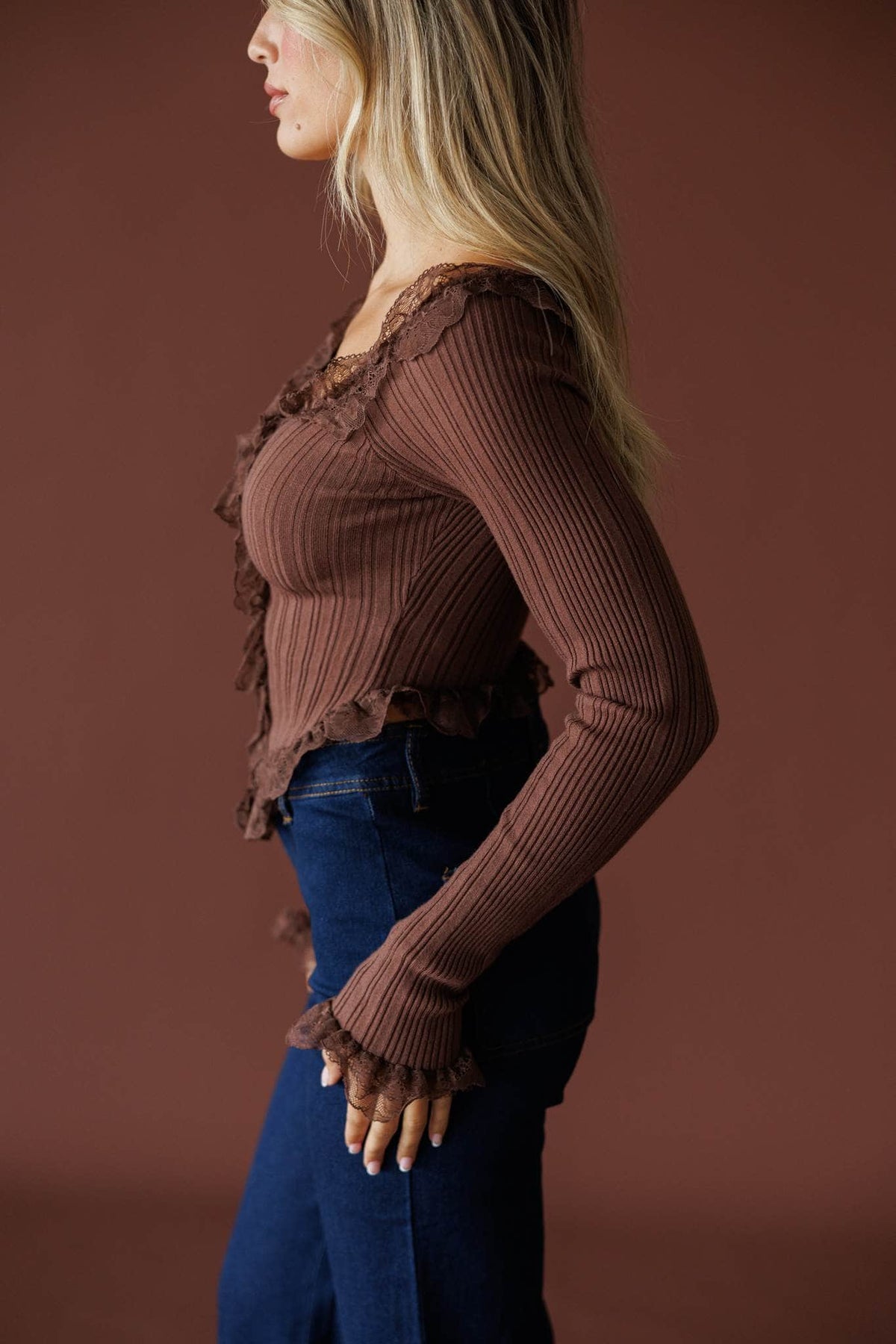 Colette Ruffle Top in mocha, side view showing the ribbed knit and ruffle cuff