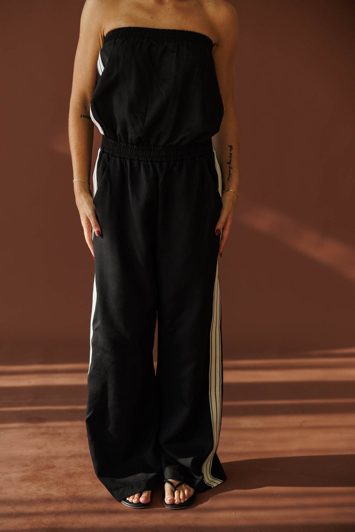 Curtain Call Jumpsuit in black, full-length view of the wide leg jumpsuit