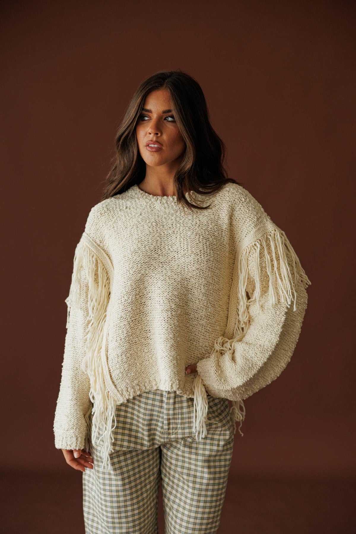 Cream Fringe Pullover Sweater, front view worn with checked trousers