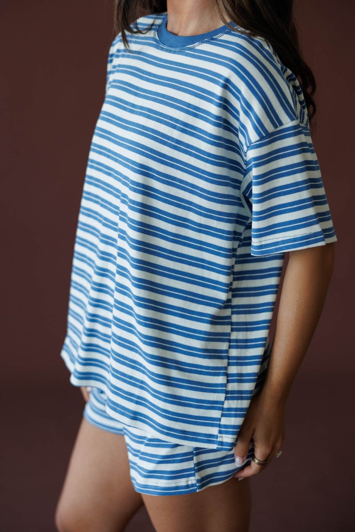 Doing Things Tee in dusty blue, side view close-up showing the drop shoulder sleeve