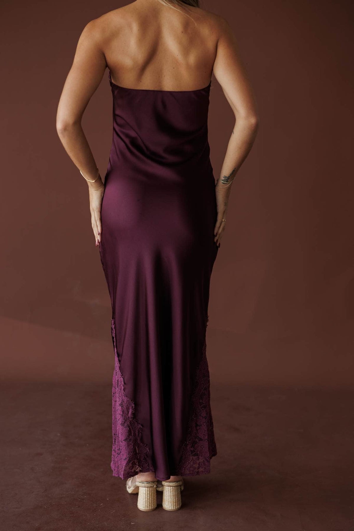 Aubergine Strapless Maxi, in deep plum, back view of the satin maxi