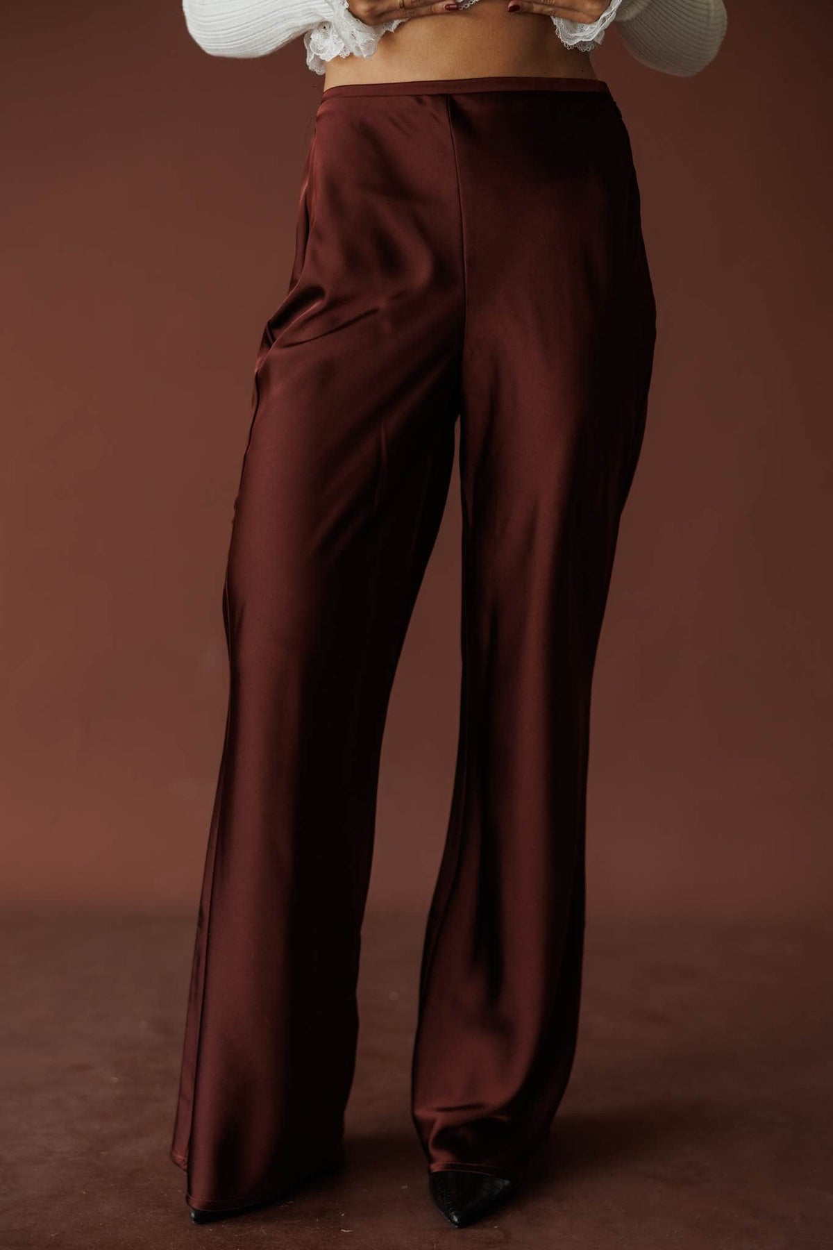 Nightcap Satin Trouser, in rum raisin, front view of the satin wide leg trousers