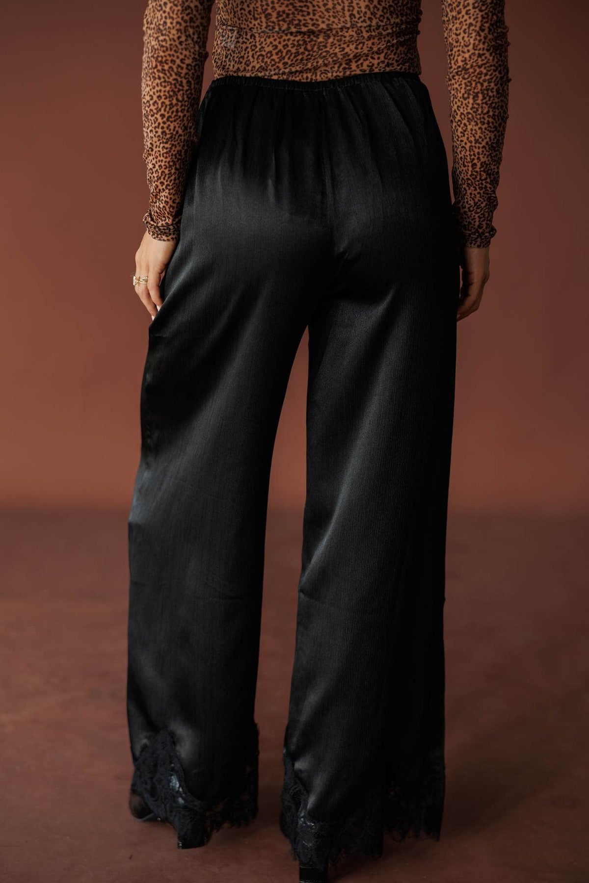 Onyx Satin Wide Leg Pants, in black, back view of the satin pants